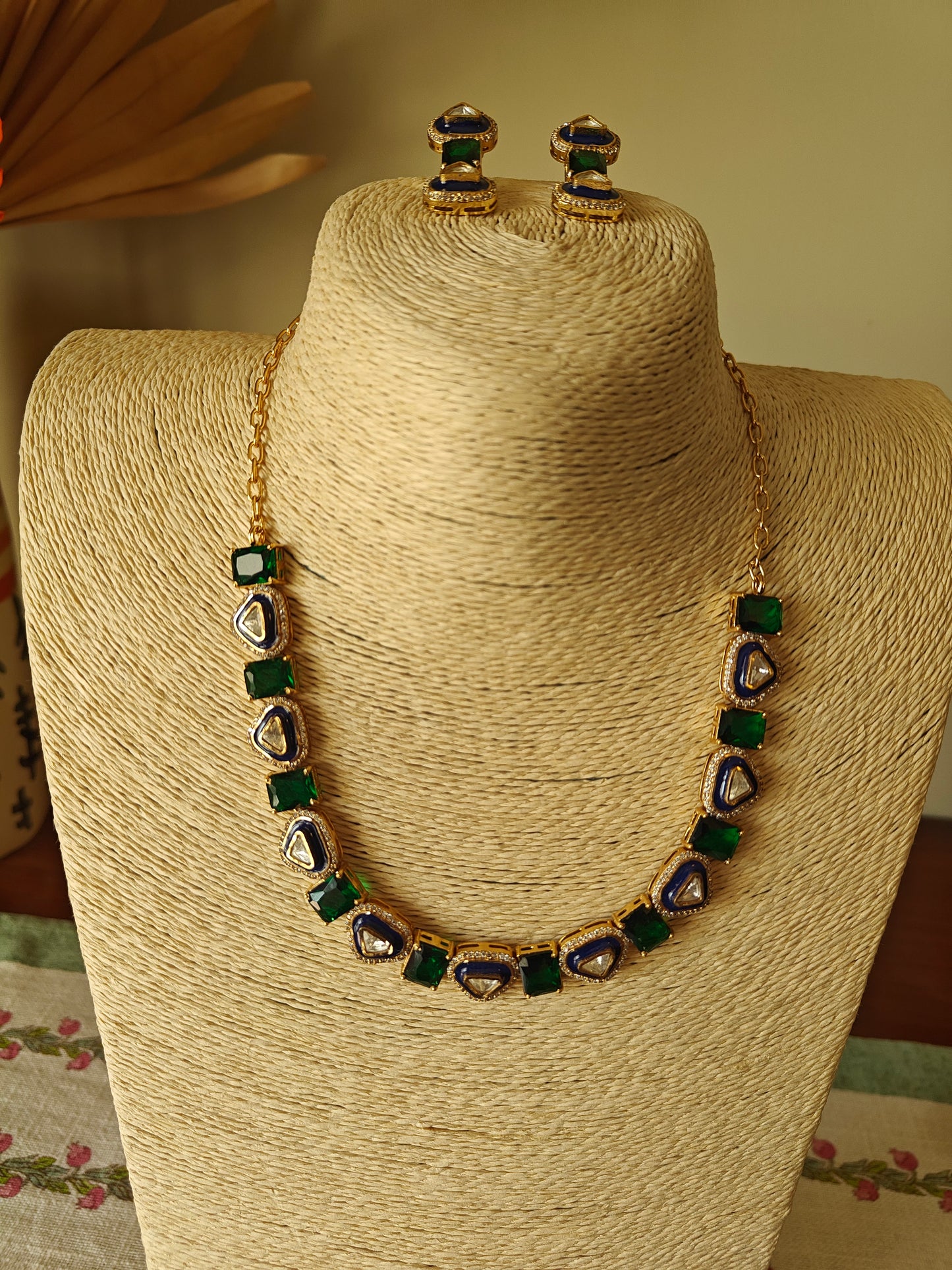 Eka set with stones alternating with triangular kundan pieces with meenakari