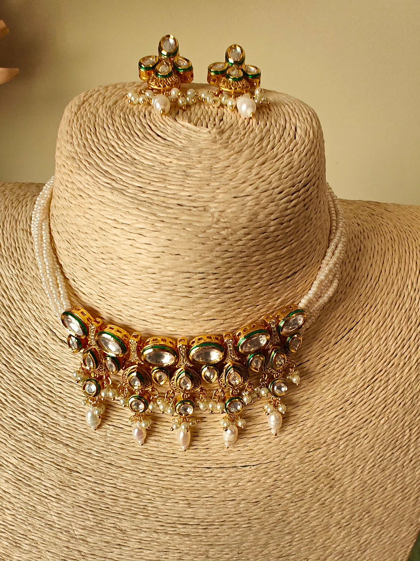 Devya set with engraved gold and kundan pieces on poth pearl strings