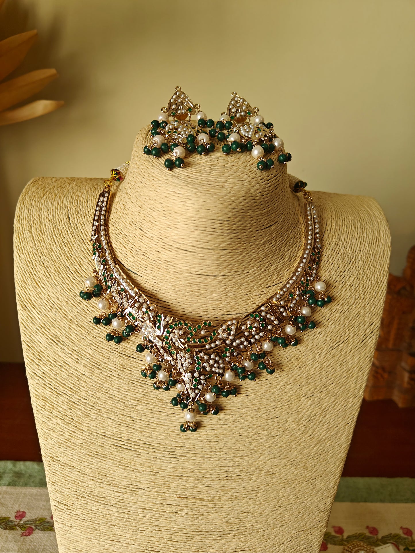 Abja jadau set with emerald green stones and pearls
