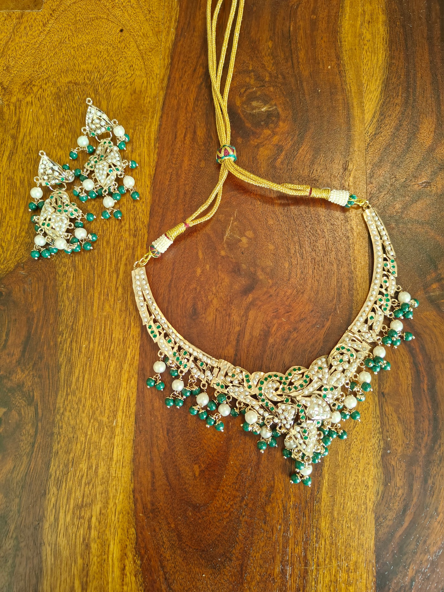 Abja jadau set with emerald green stones and pearls
