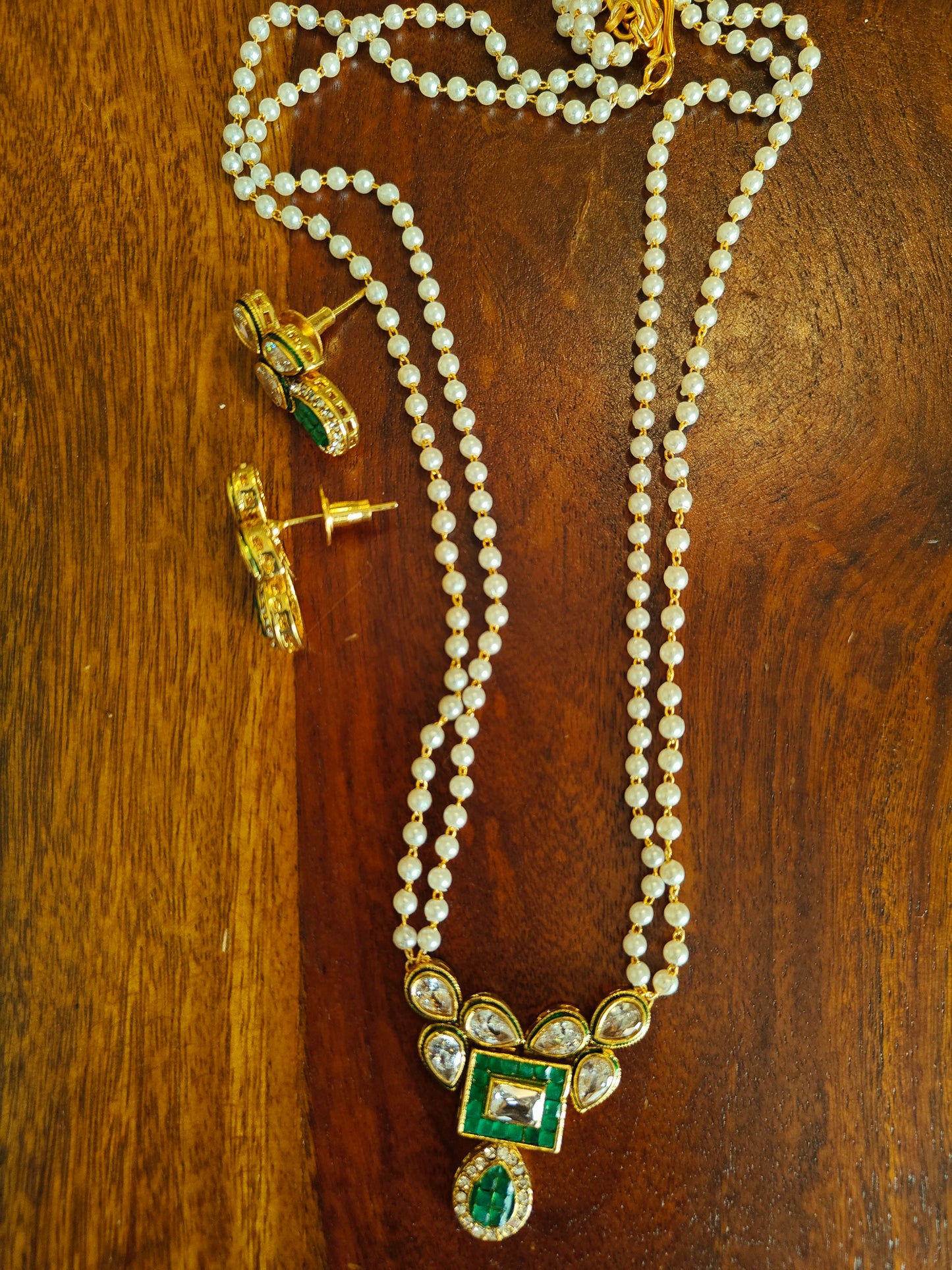 Madhumati set with kundan and stone on pearl strings