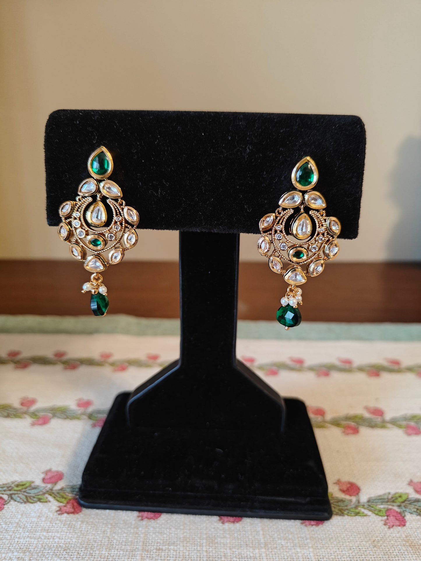 Chhabi earrings with kundan and emerald green stone