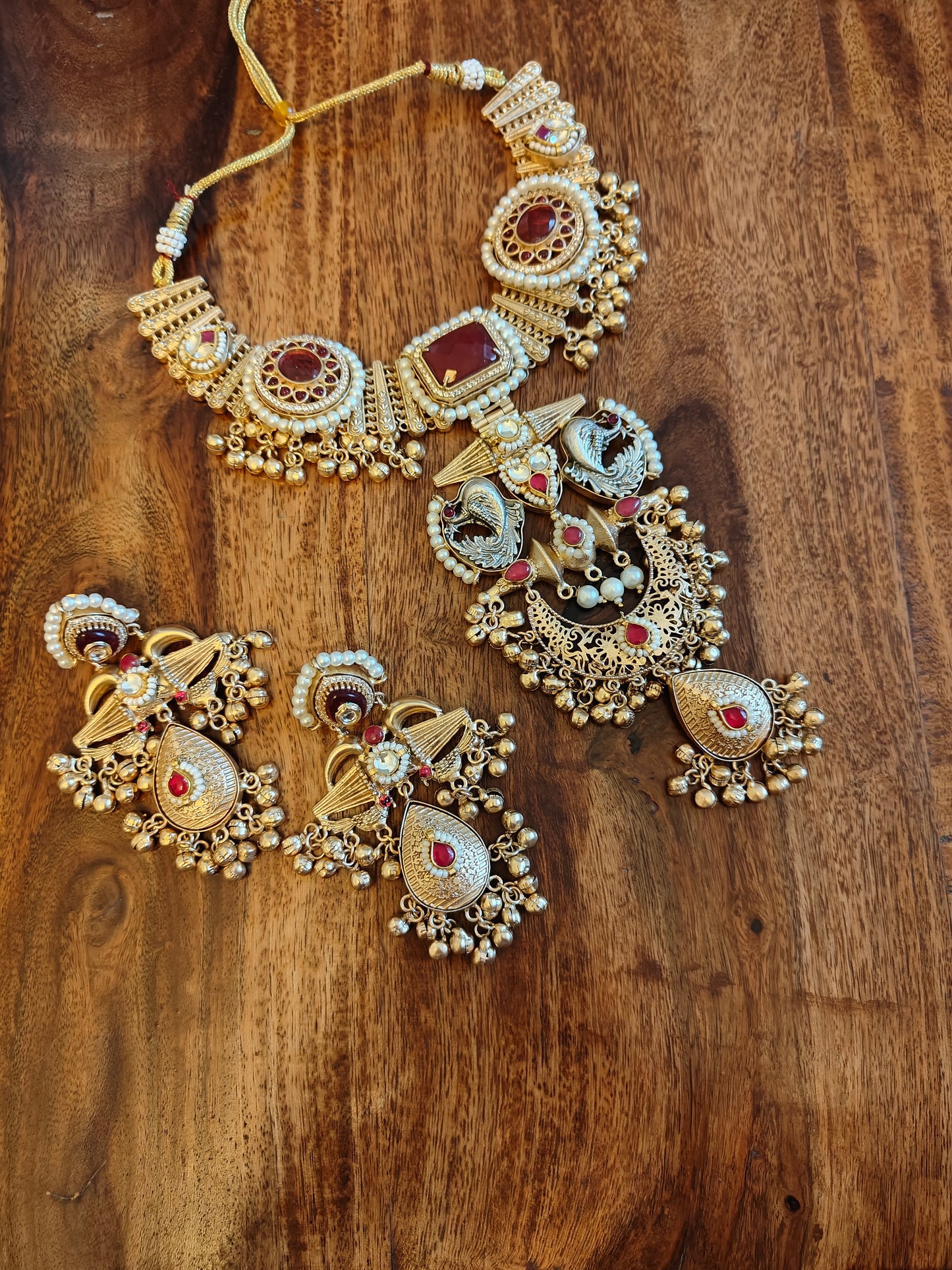 Nirmitha dual tone set with red stones
