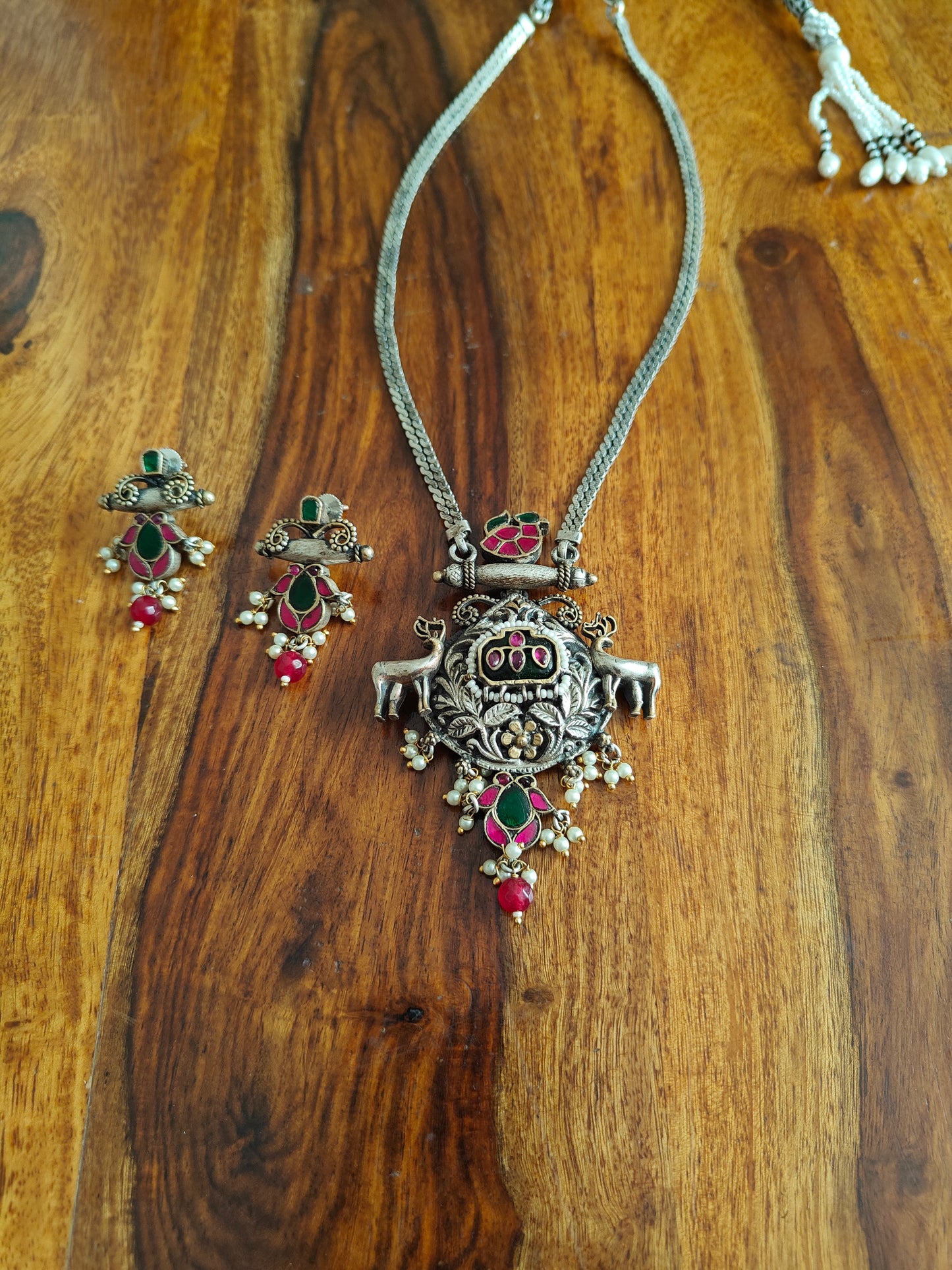 Kuyil set in dual tone with deers and kemp stones