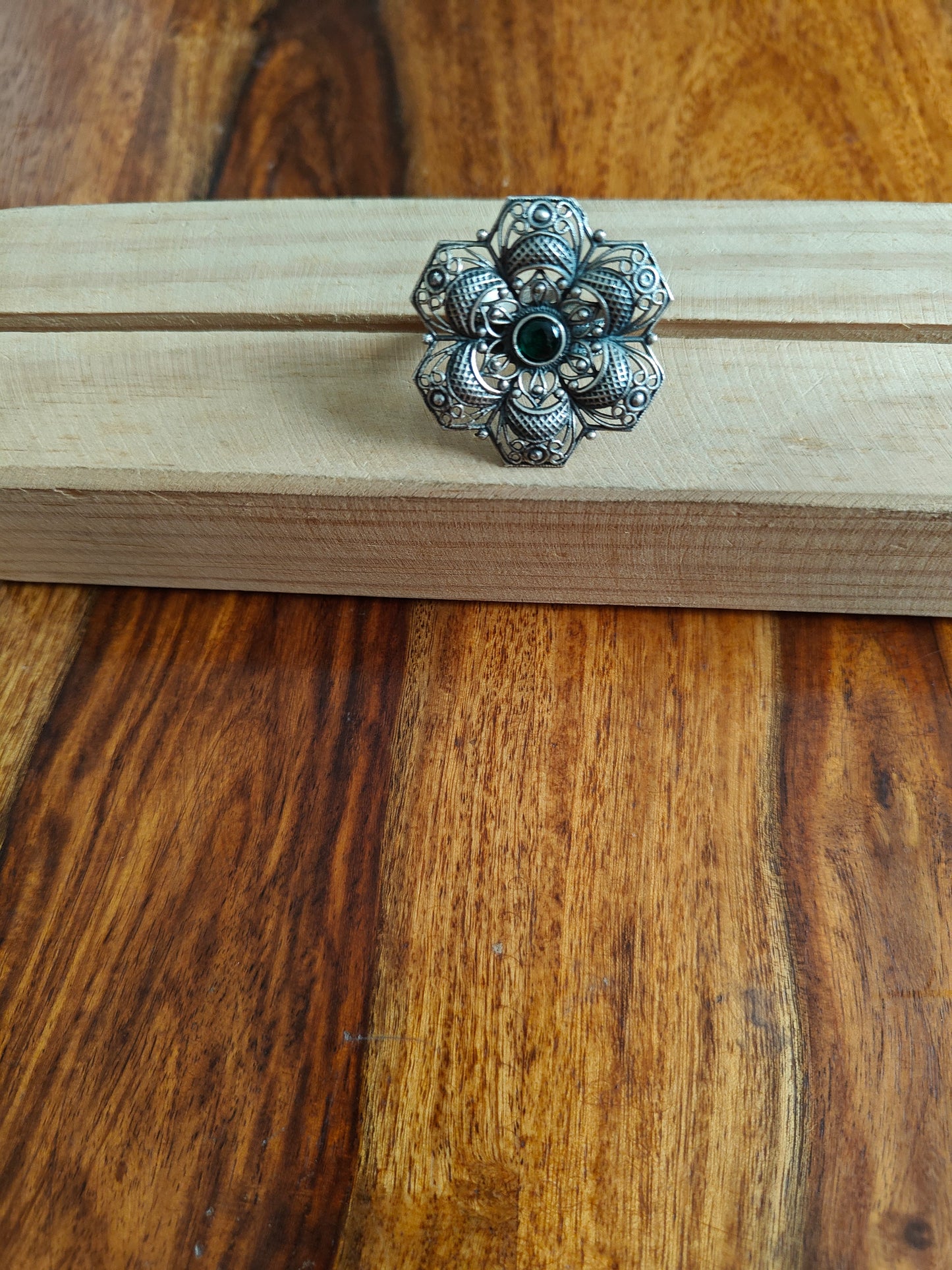 Sterling silver flower ring with green emerald stone