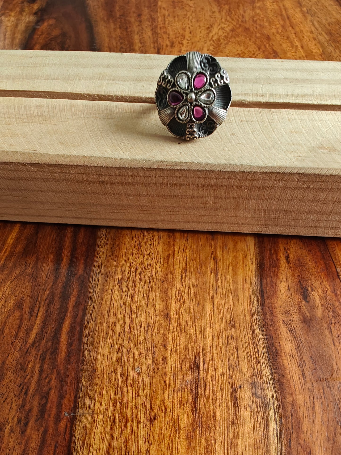 Sterling silver ring with ruby red and transparent stone in antique finish