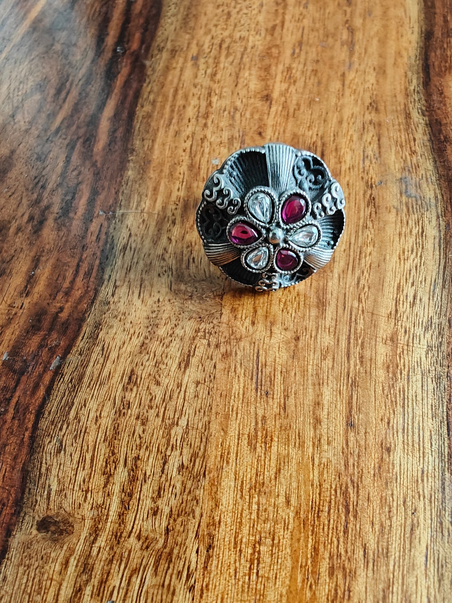 Sterling silver ring with ruby red and transparent stone in antique finish