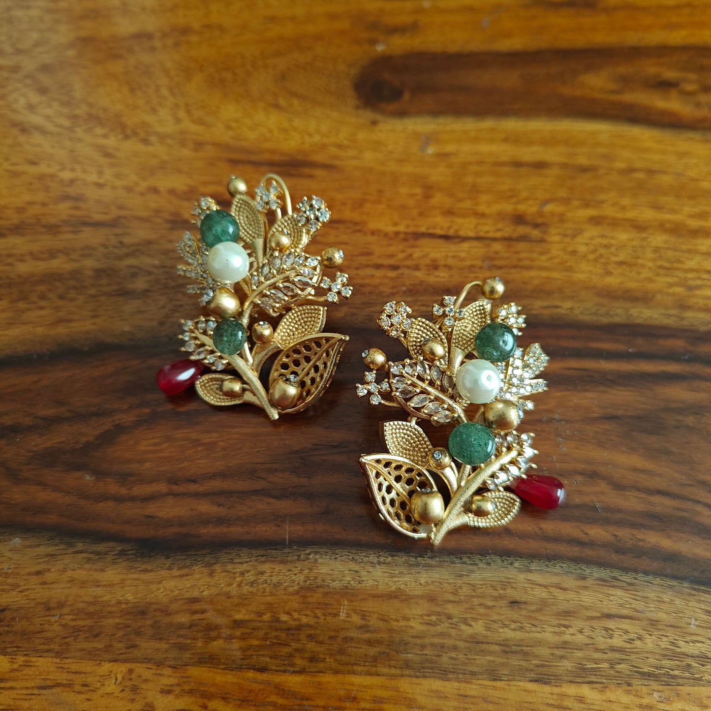 Elaborate twig and stone flower earrings