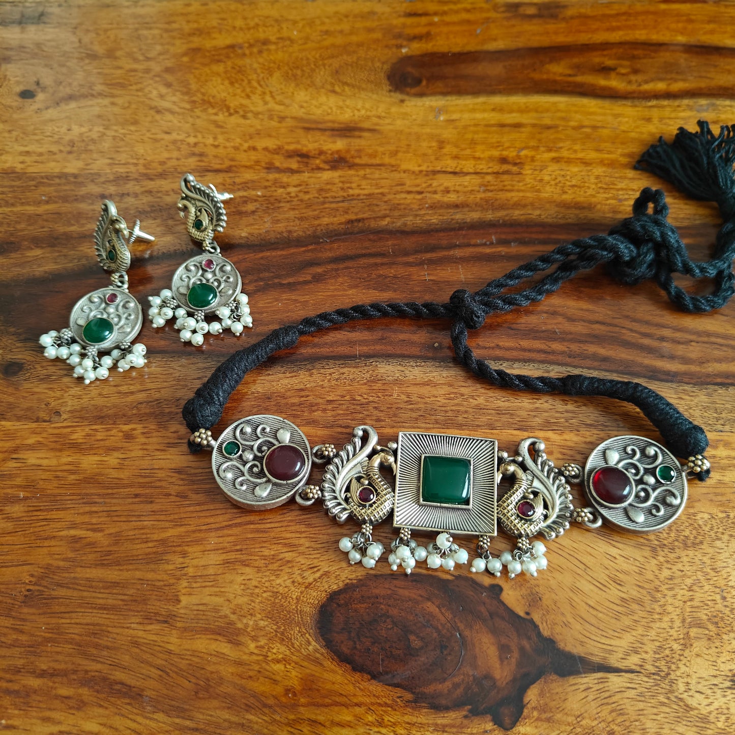 Dual tone choker set with square centre with stone and peacocks