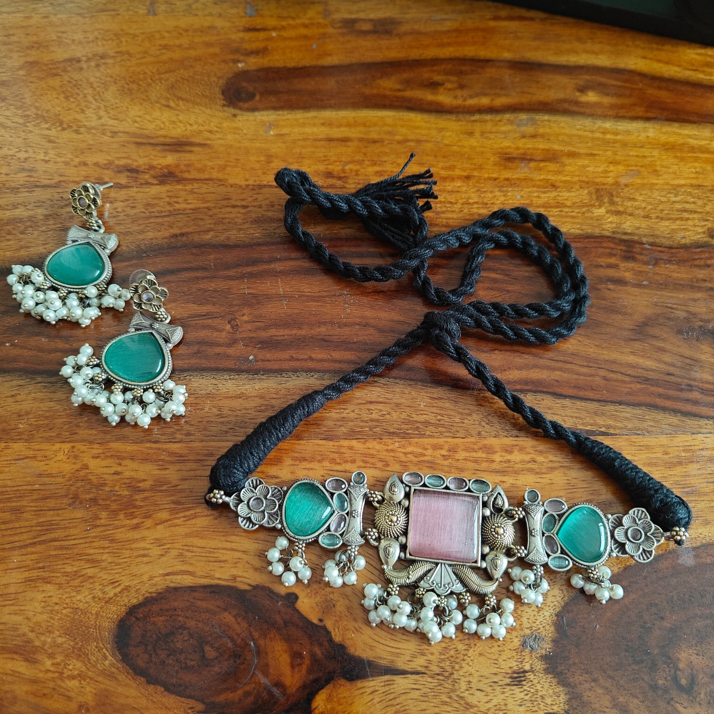 Dual tone choker with pink square and green stones on side
