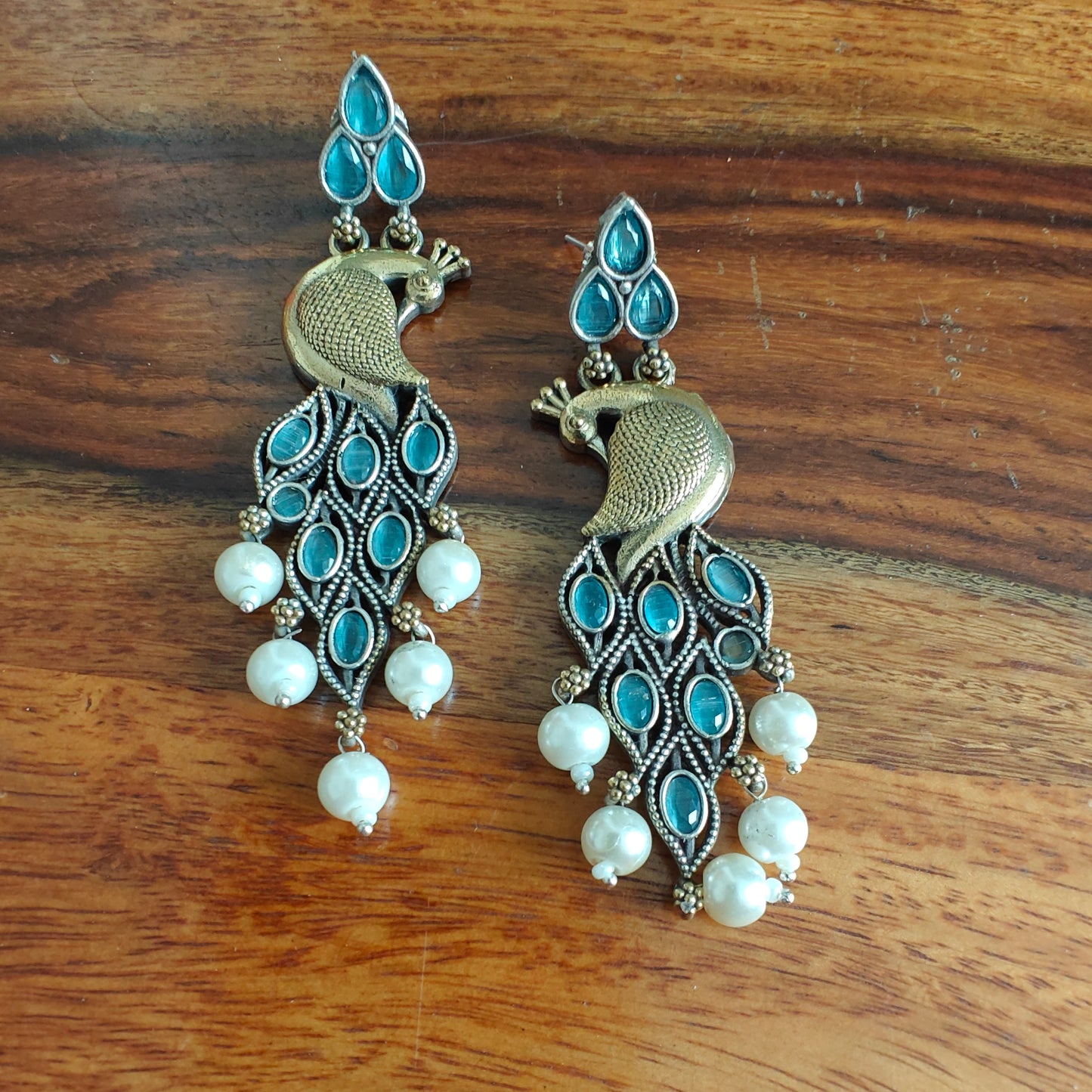 Dual tone peacock earrings with stone