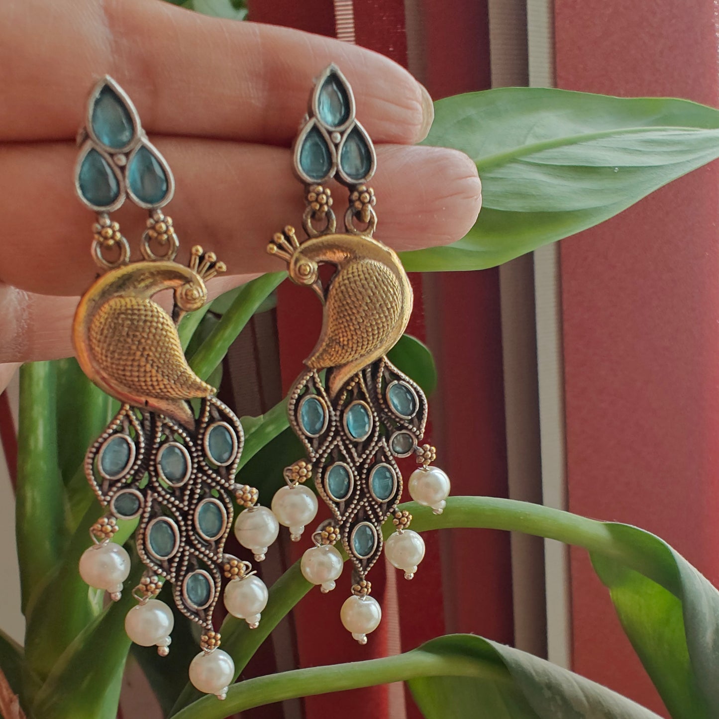 Dual tone peacock earrings with stone
