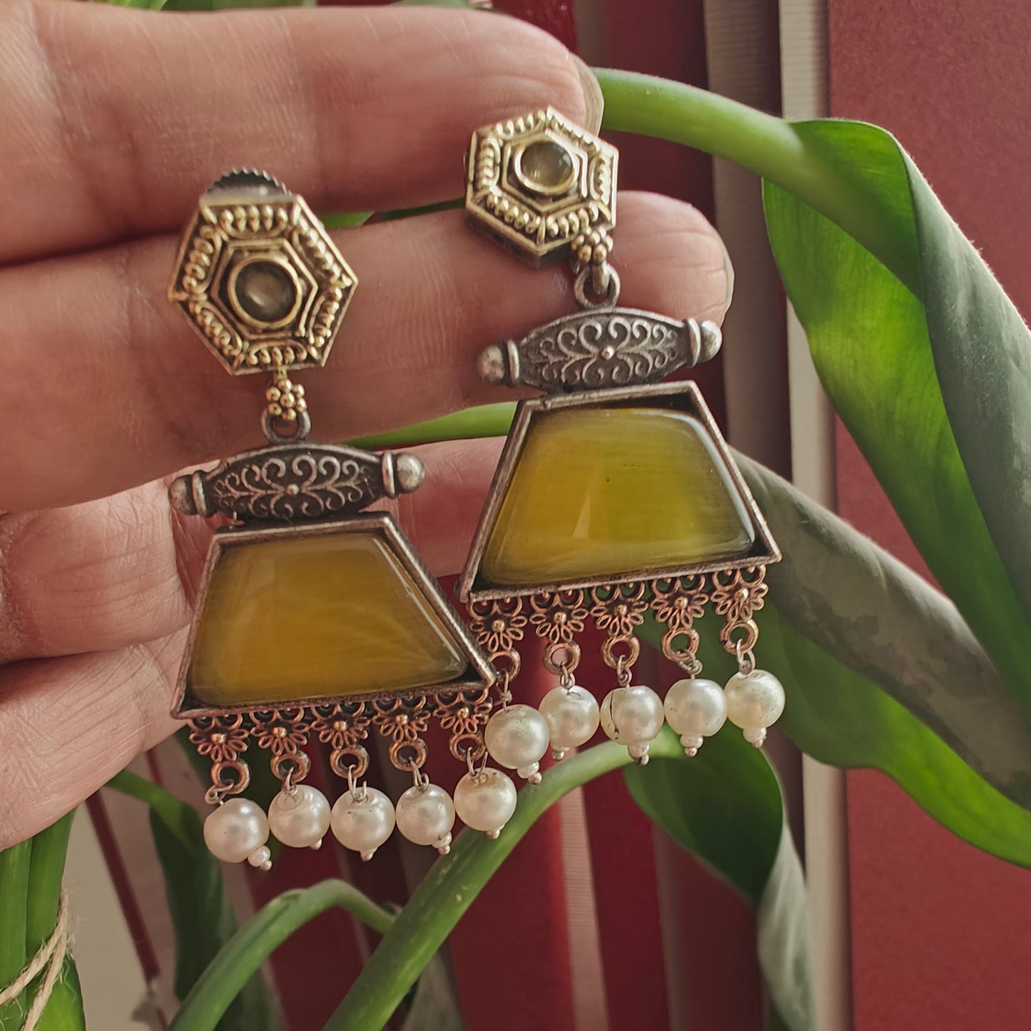 Dual tone earrings with coloured stone