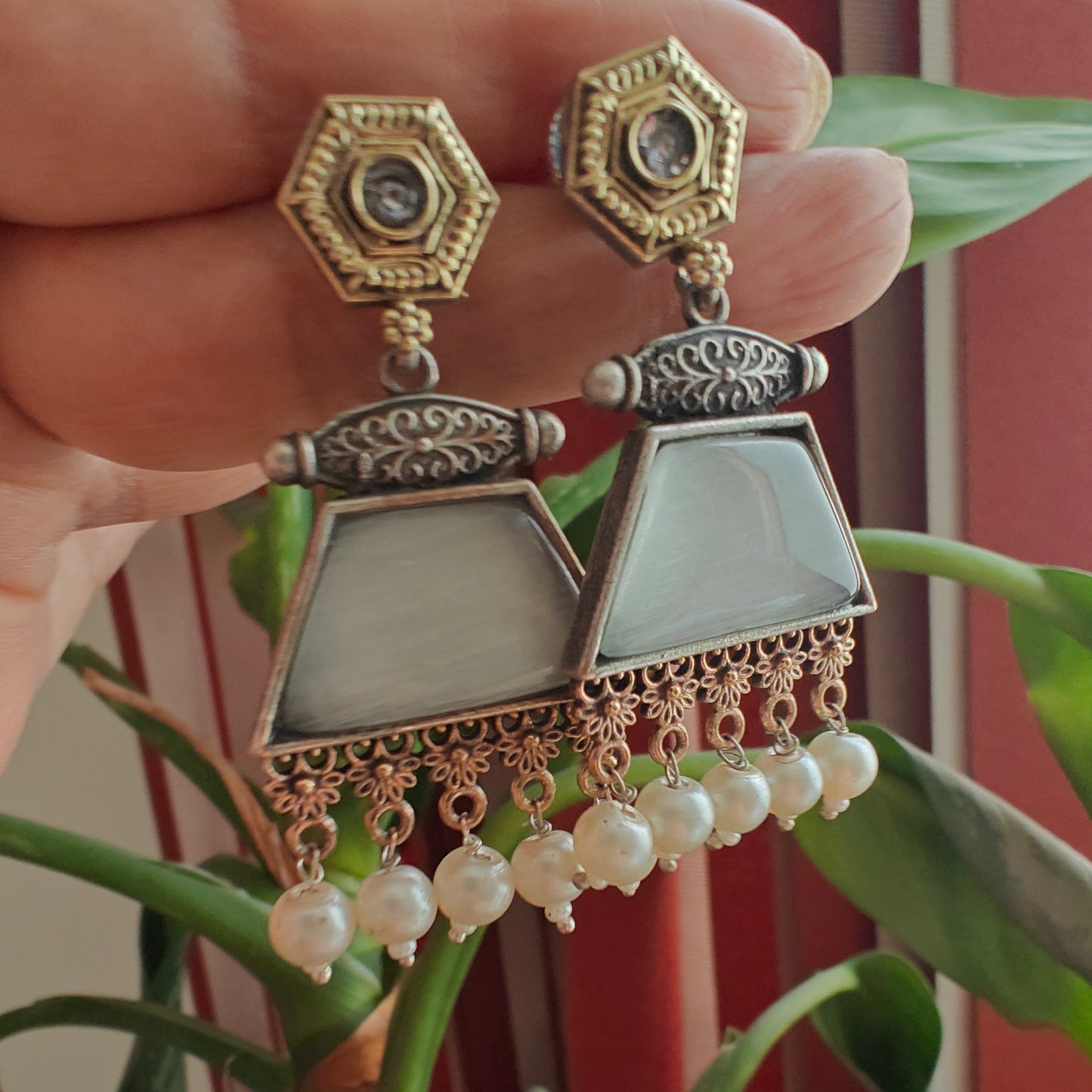 Dual tone earrings with coloured stone
