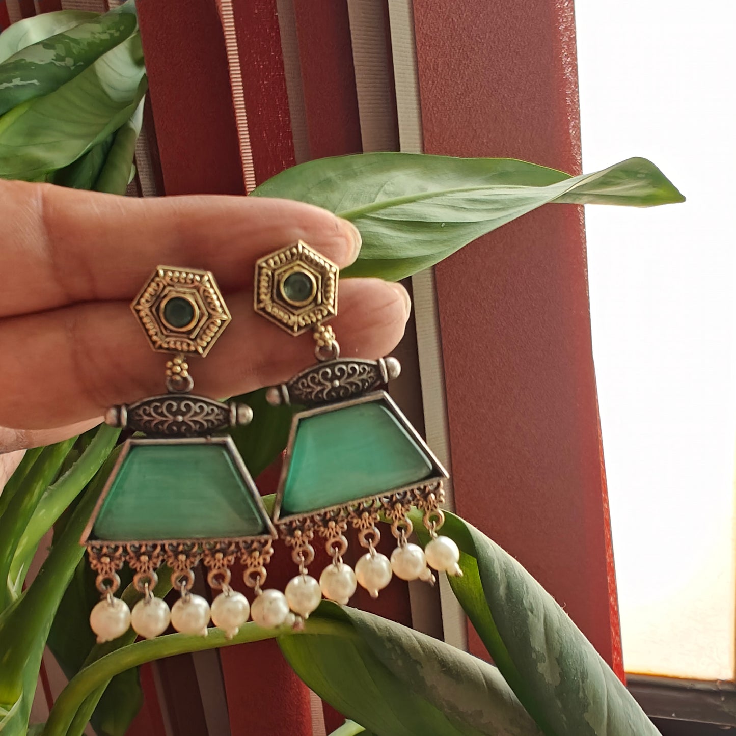 Dual tone earrings with coloured stone