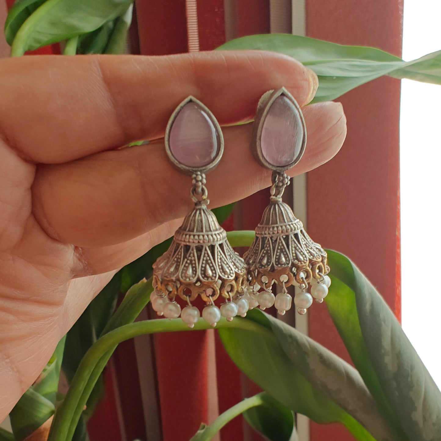 Dual tone jhumkis with jali design on stone stud