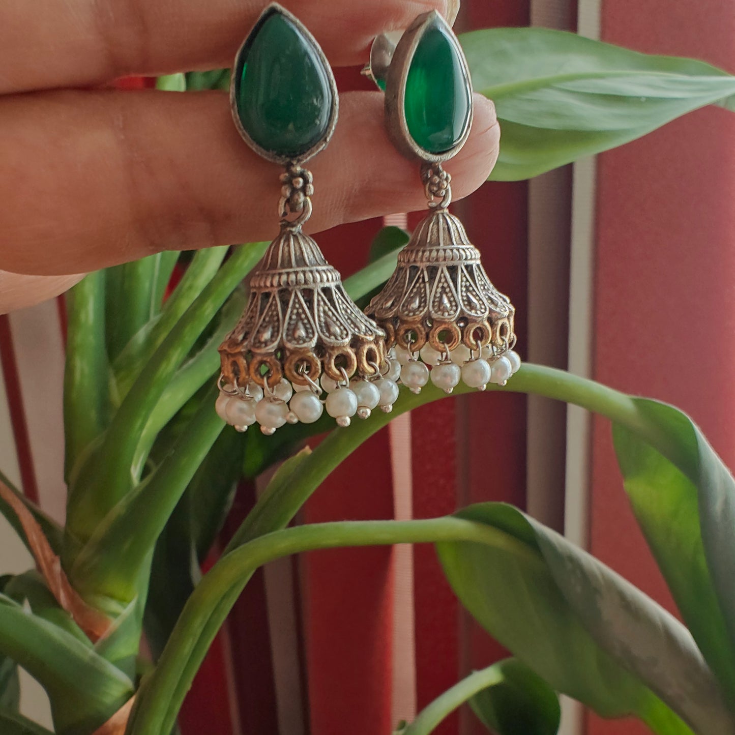 Dual tone jhumkis with jali design on stone stud