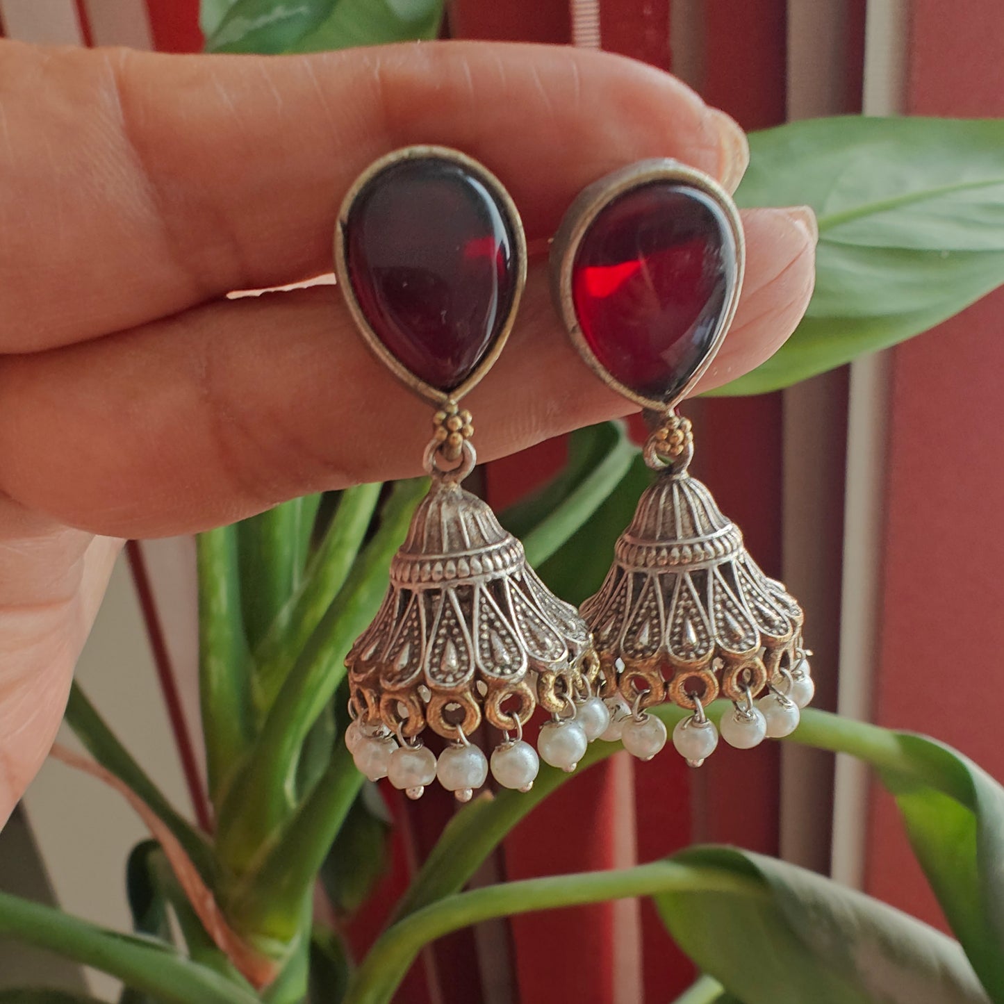 Dual tone jhumkis with jali design on stone stud