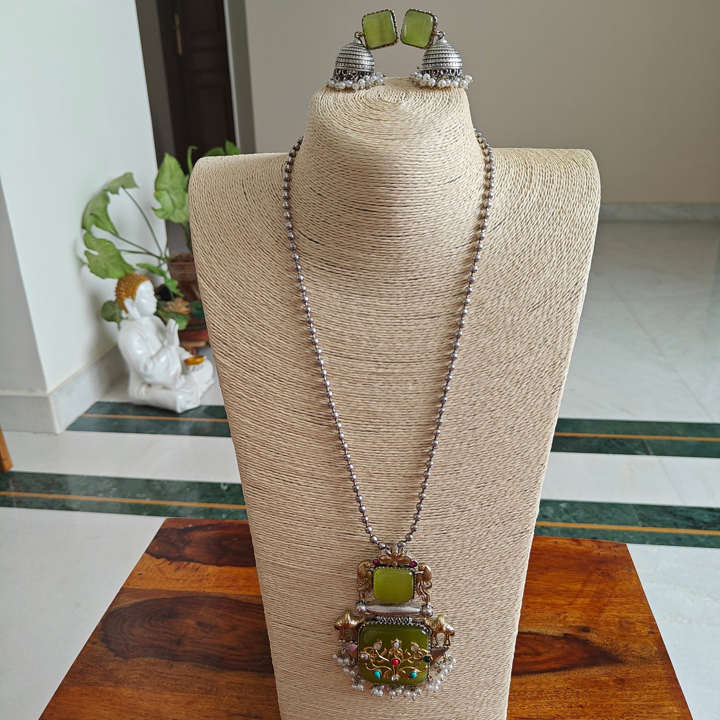 Dual tone set with stone pendant with work and stones on top