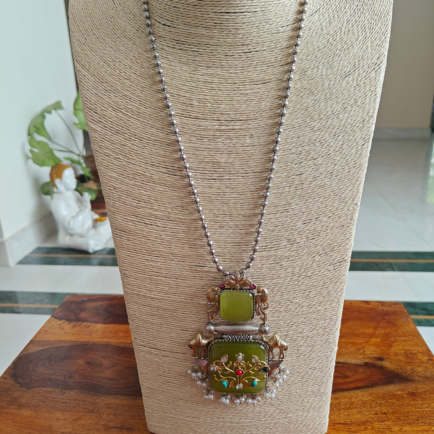 Dual tone set with stone pendant with work and stones on top