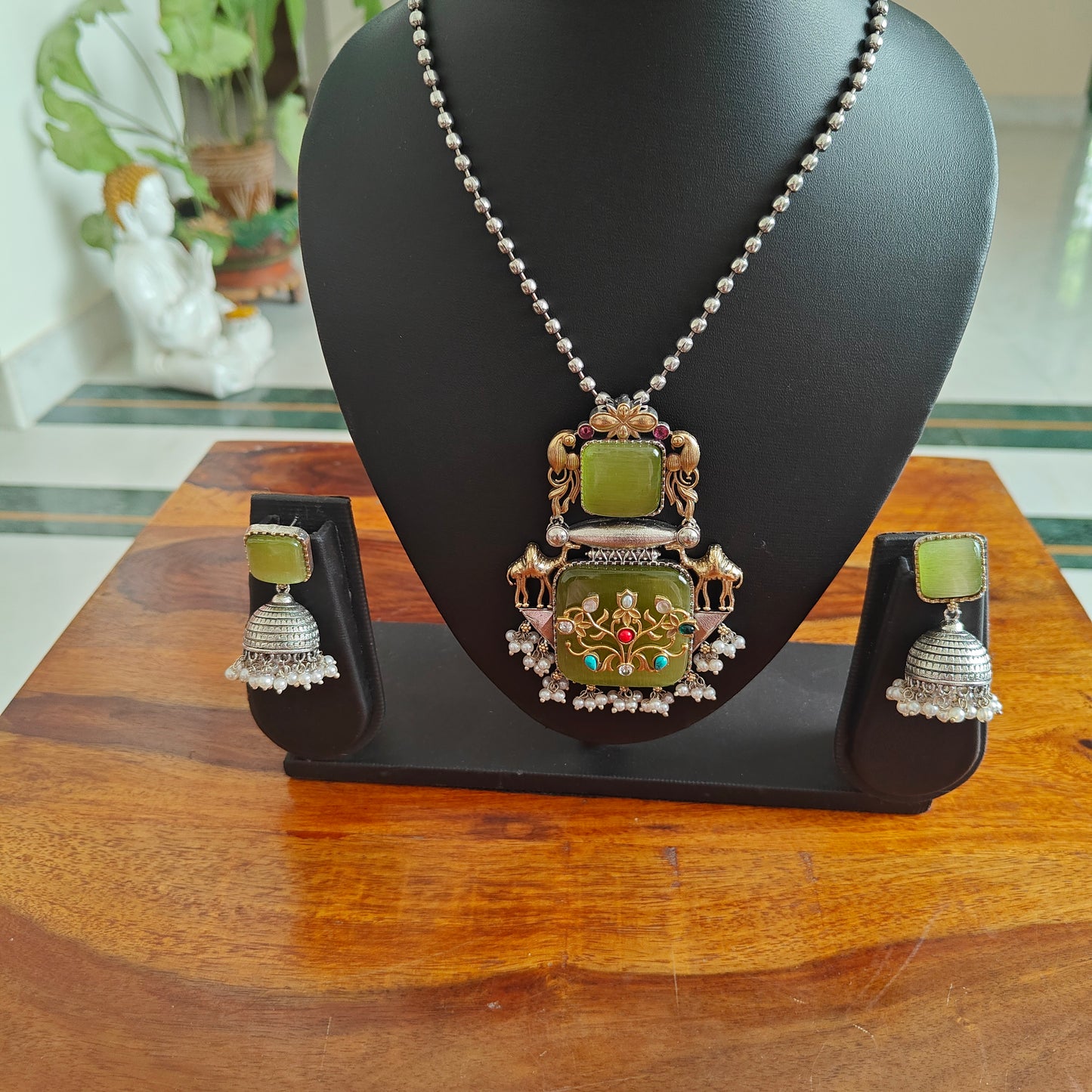 Dual tone set with stone pendant with work and stones on top