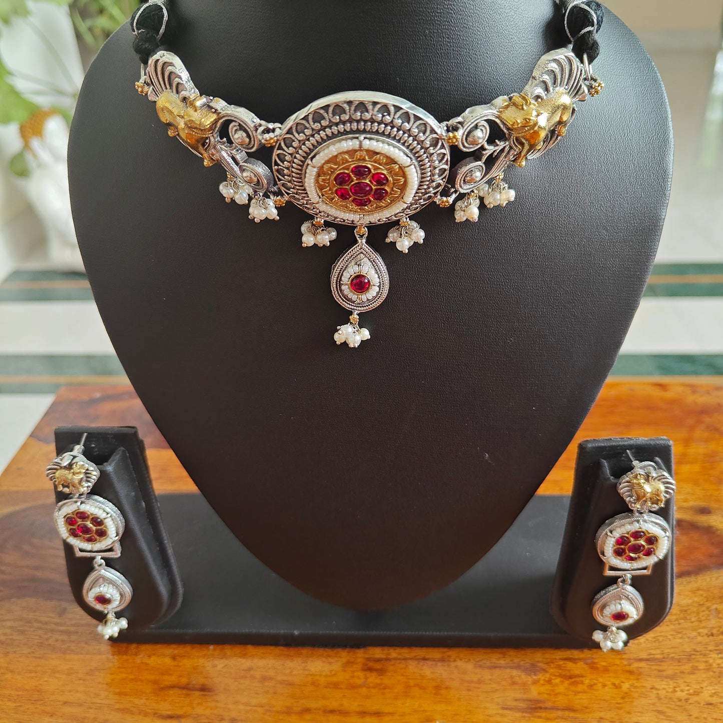 Dual tone choker set with cow motif,stones and pearls