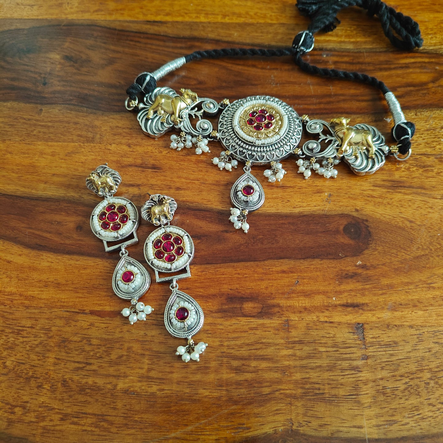 Dual tone choker set with cow motif,stones and pearls