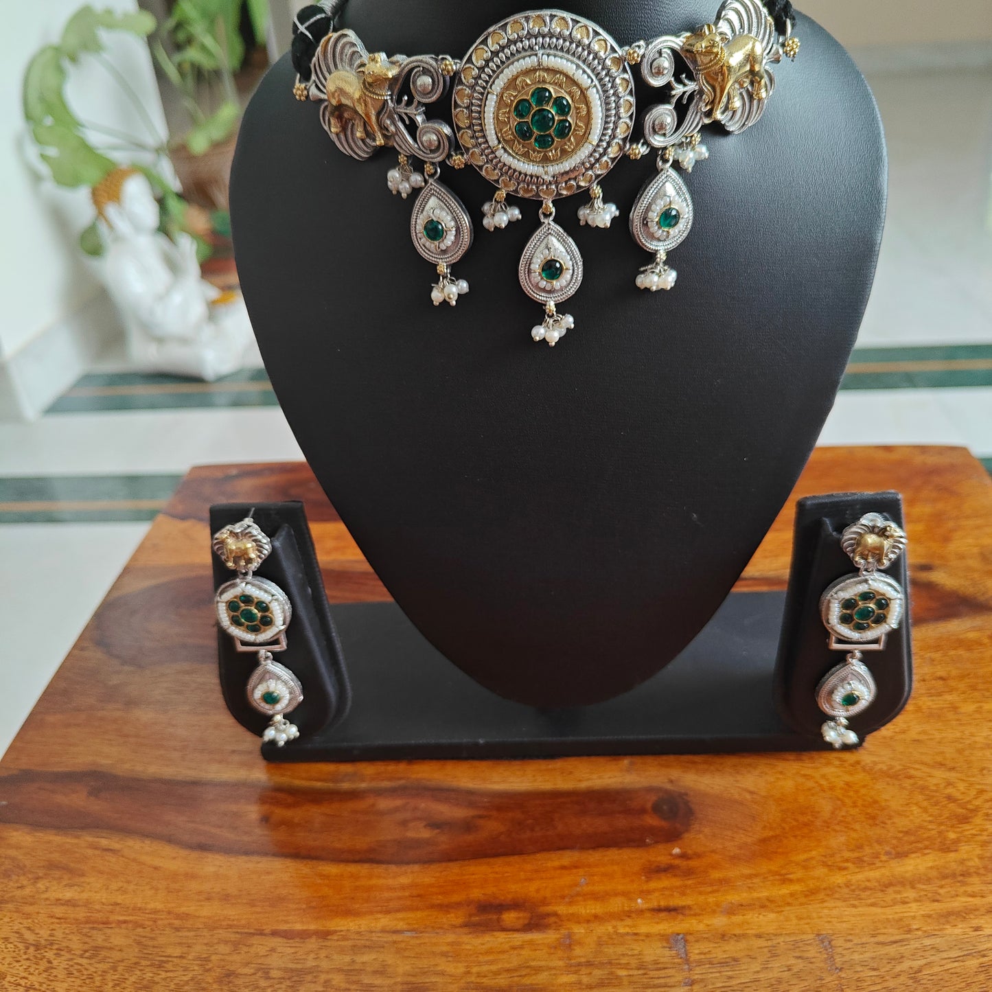 Dual tone choker set with cow motif,stones and pearls