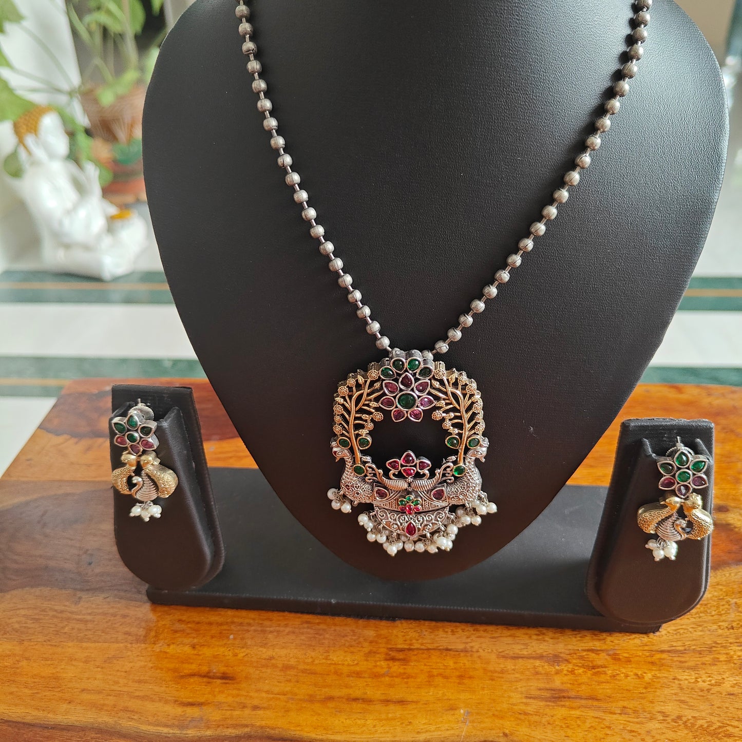 Dual tone two peacock pendant set on bead chain