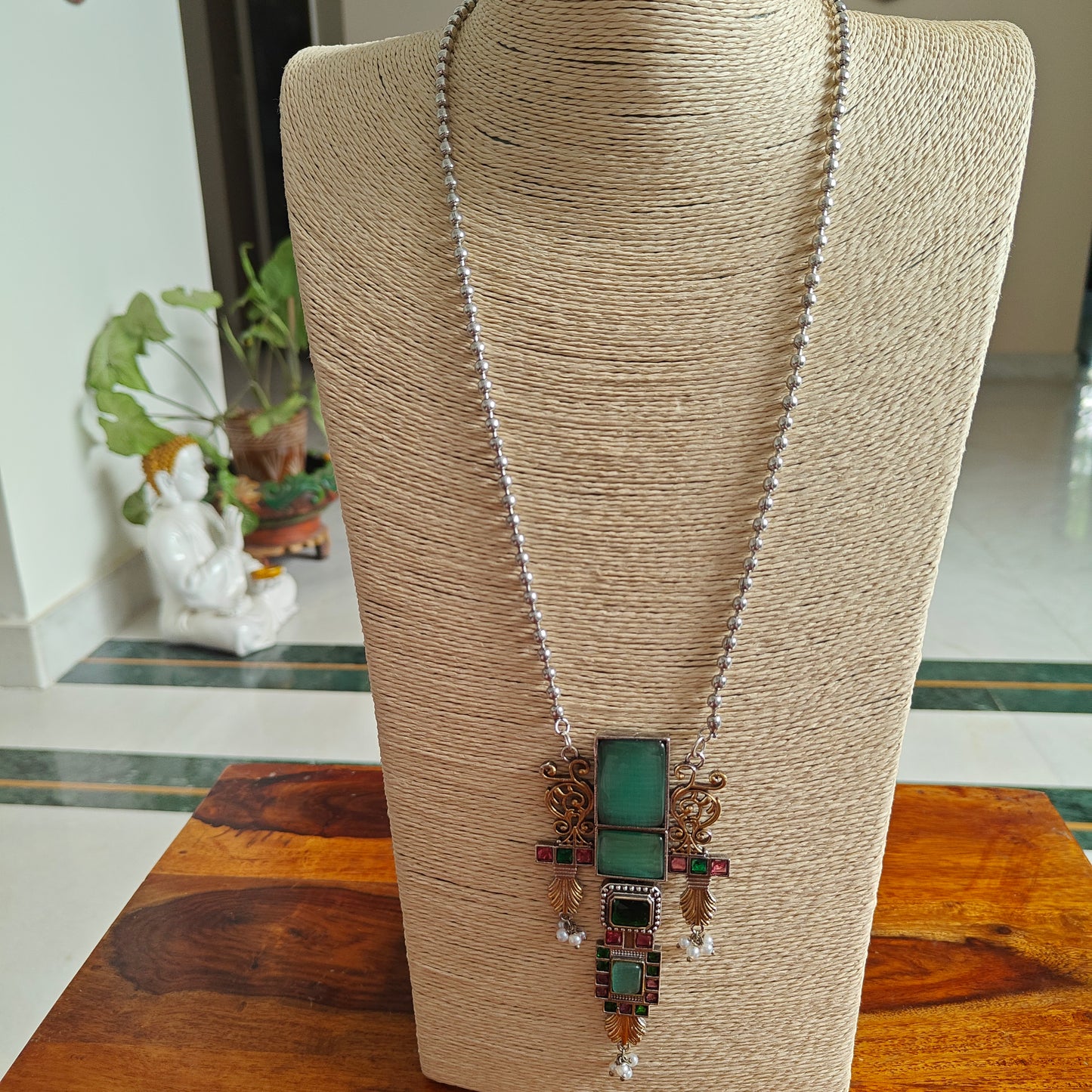 Dual tone long stone pendant set with work