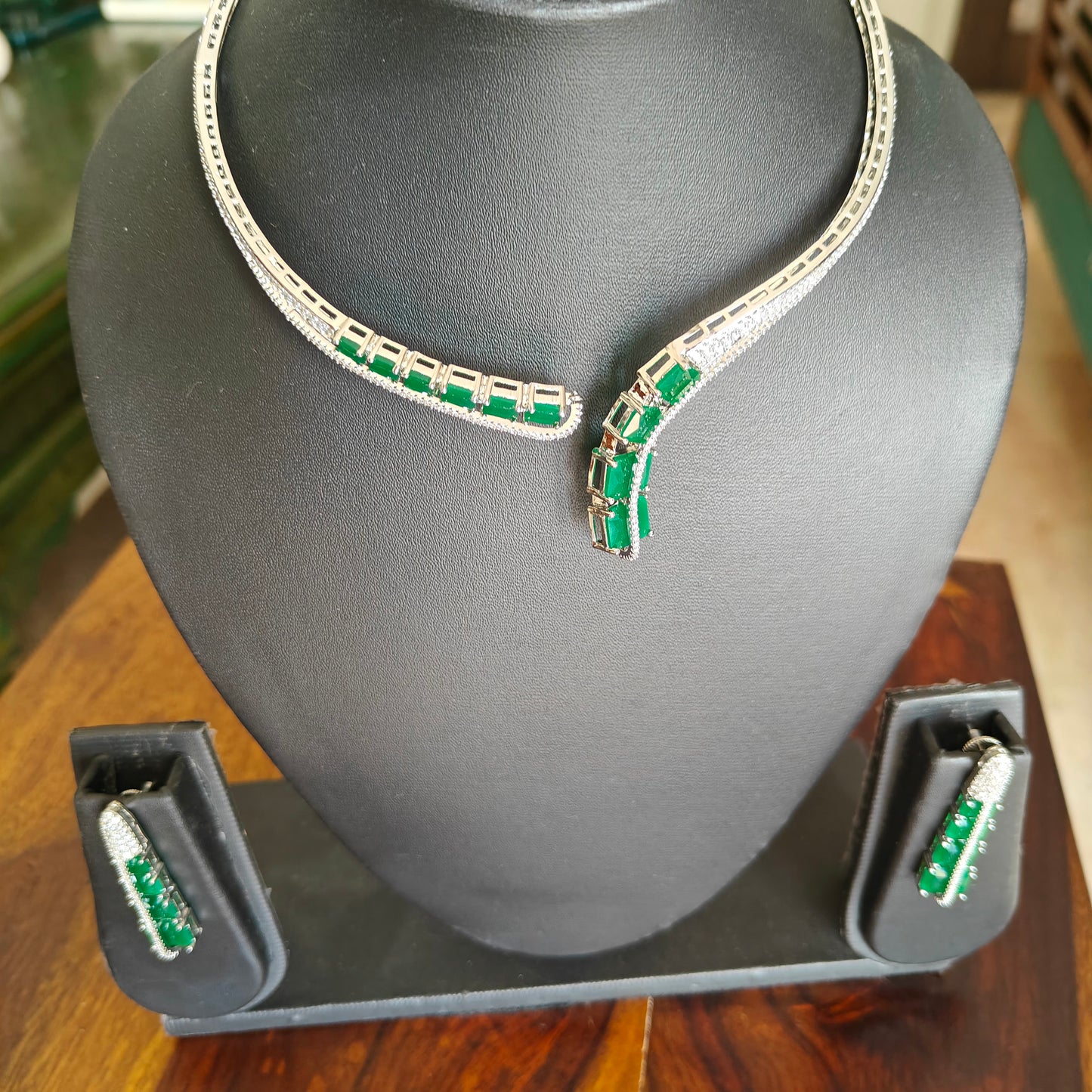 Pival set with green emeralds and Cz