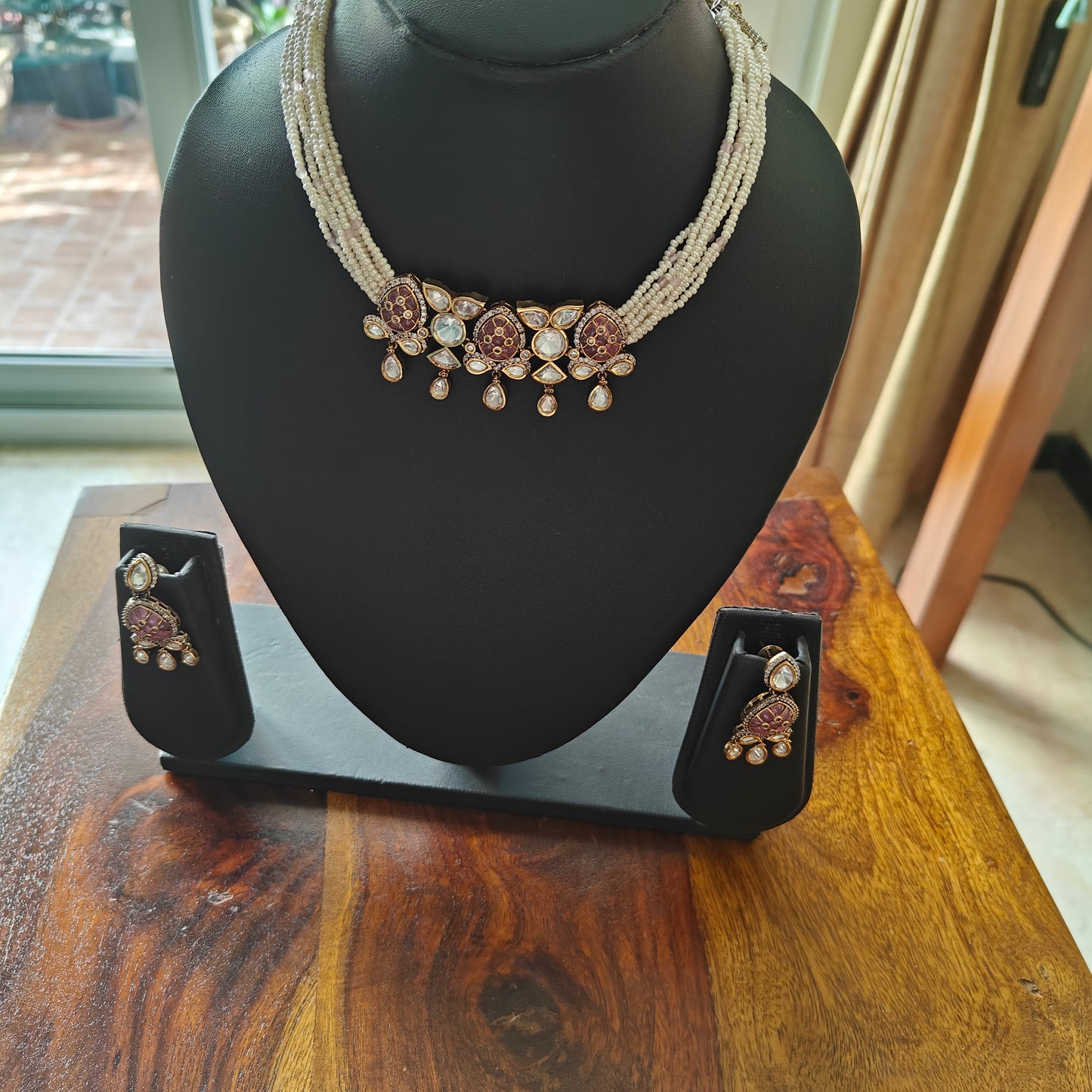 Jaiman choker set with pink stones and moissanite on poth pearl strings