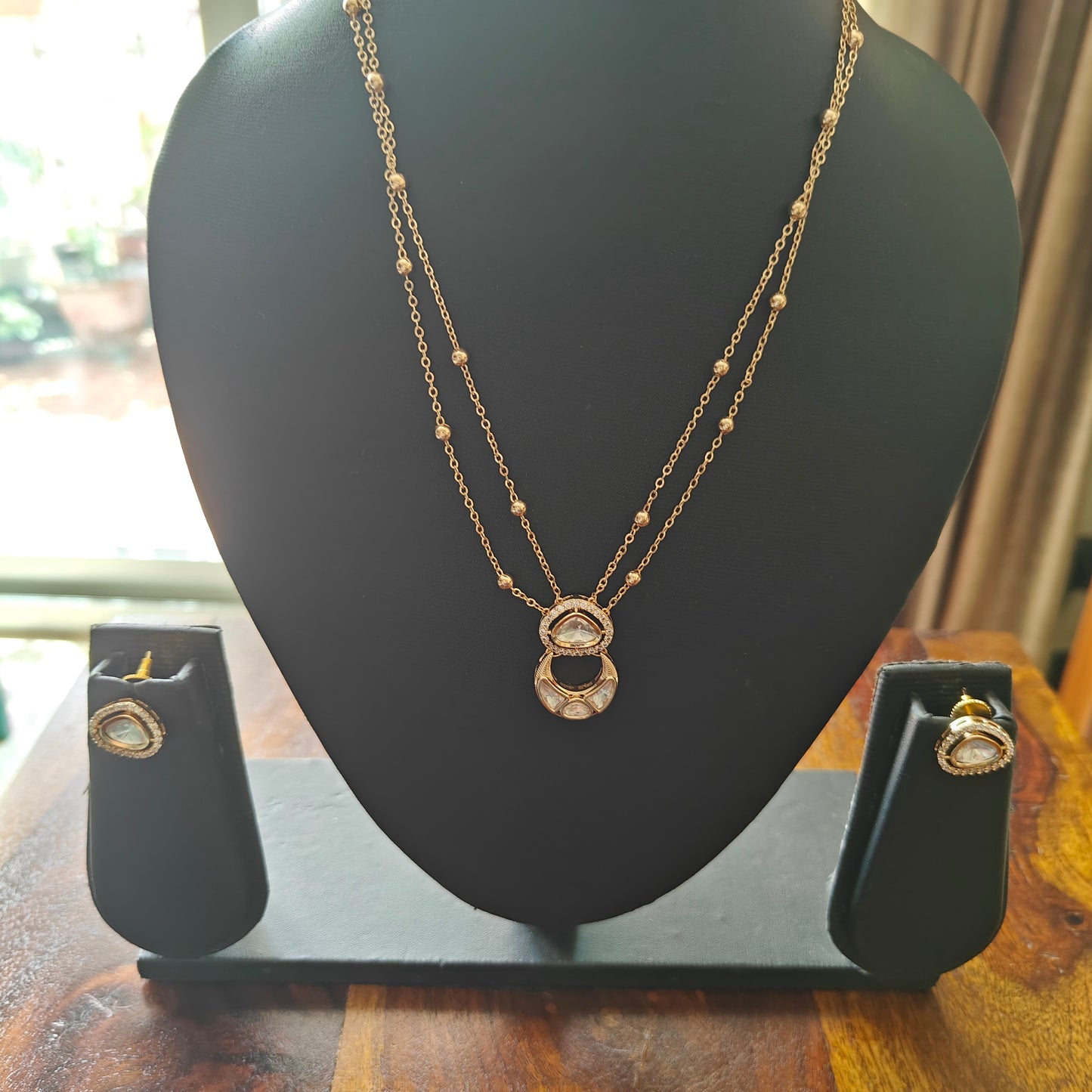Delicate Nimisha set with suspended kundan pieces