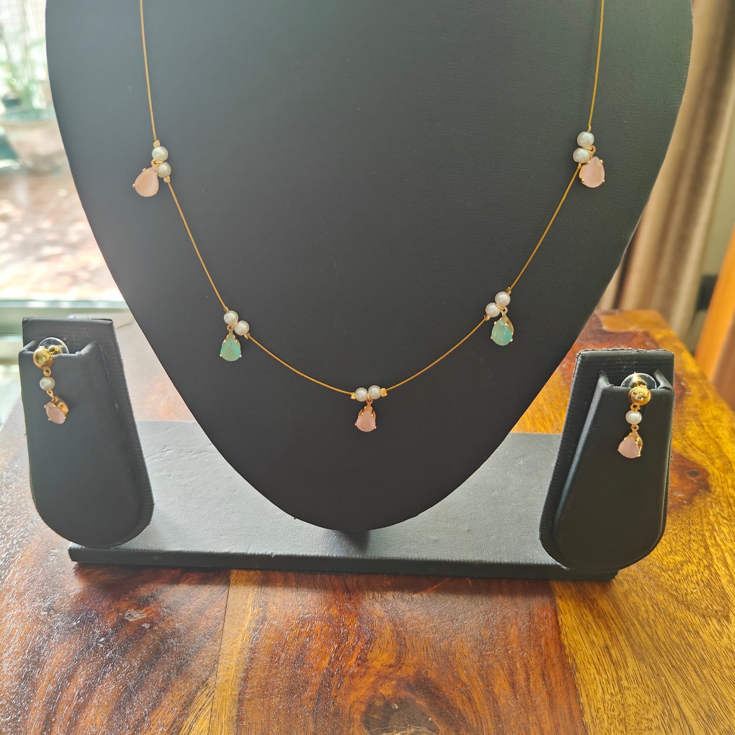 Set with stones on a stiff chain