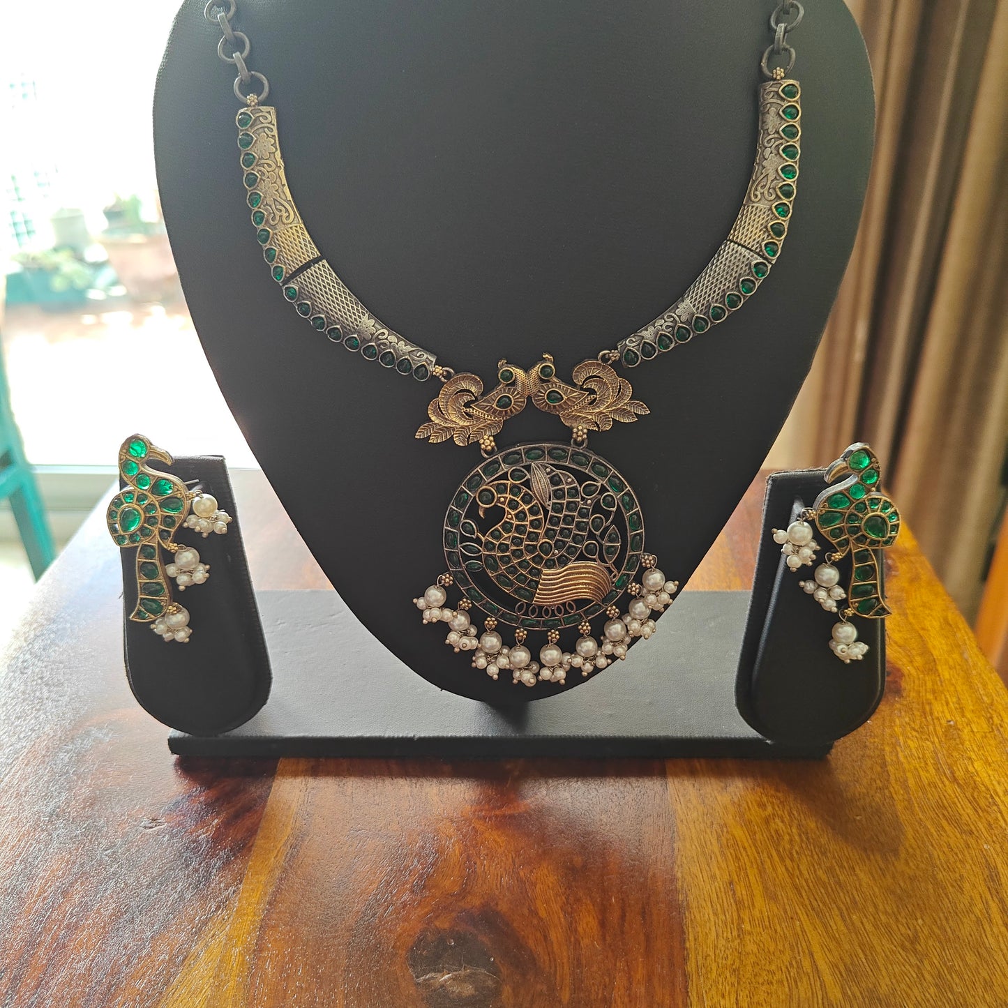 Dual tone set with peacocks and stones