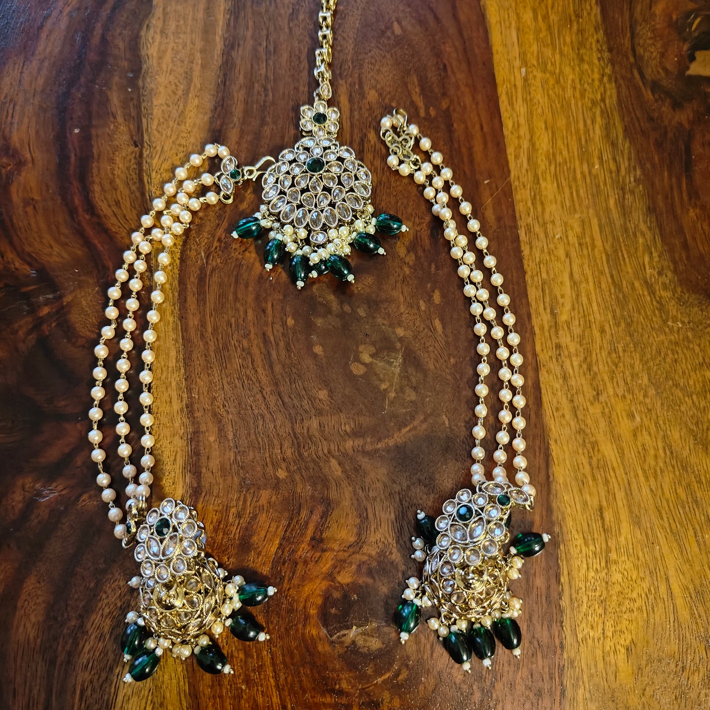 Big stone jhumkis(earrings),pearl chains,mang tikka
