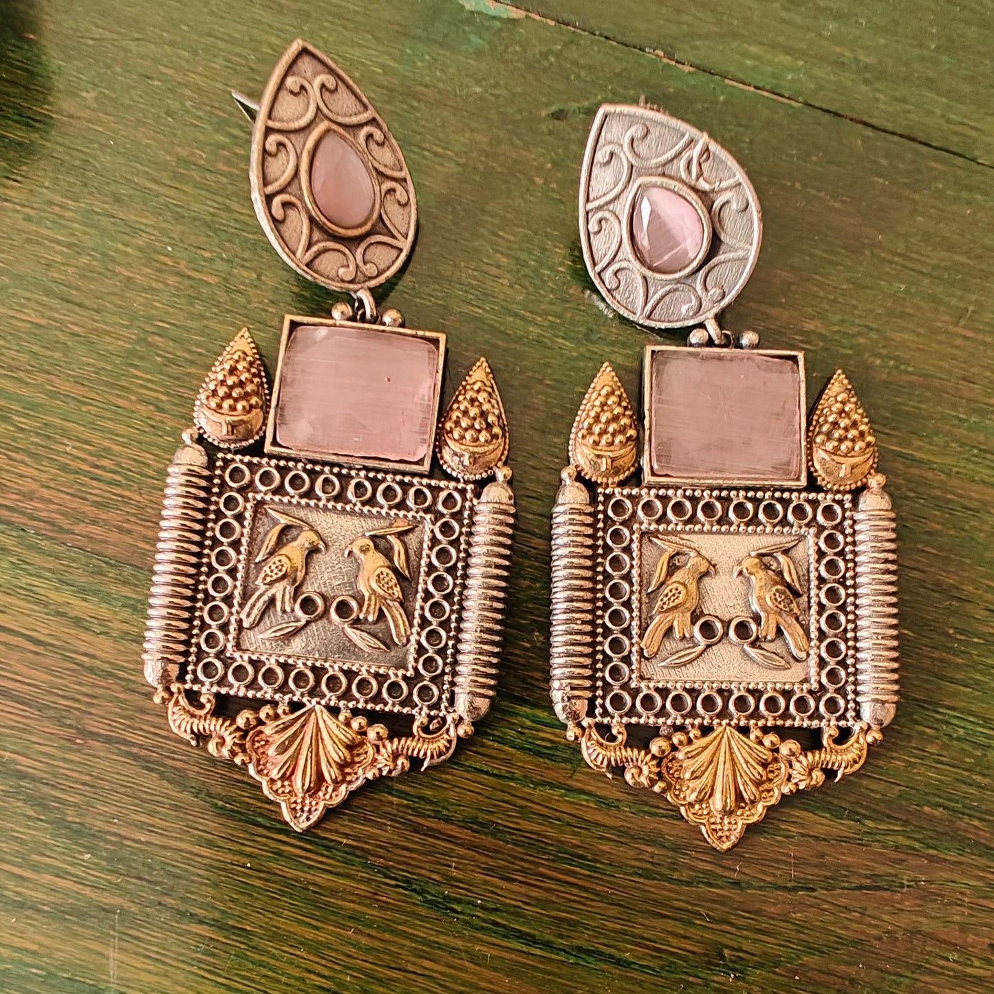Dual tone earrings with baby pink stone and birds engraved