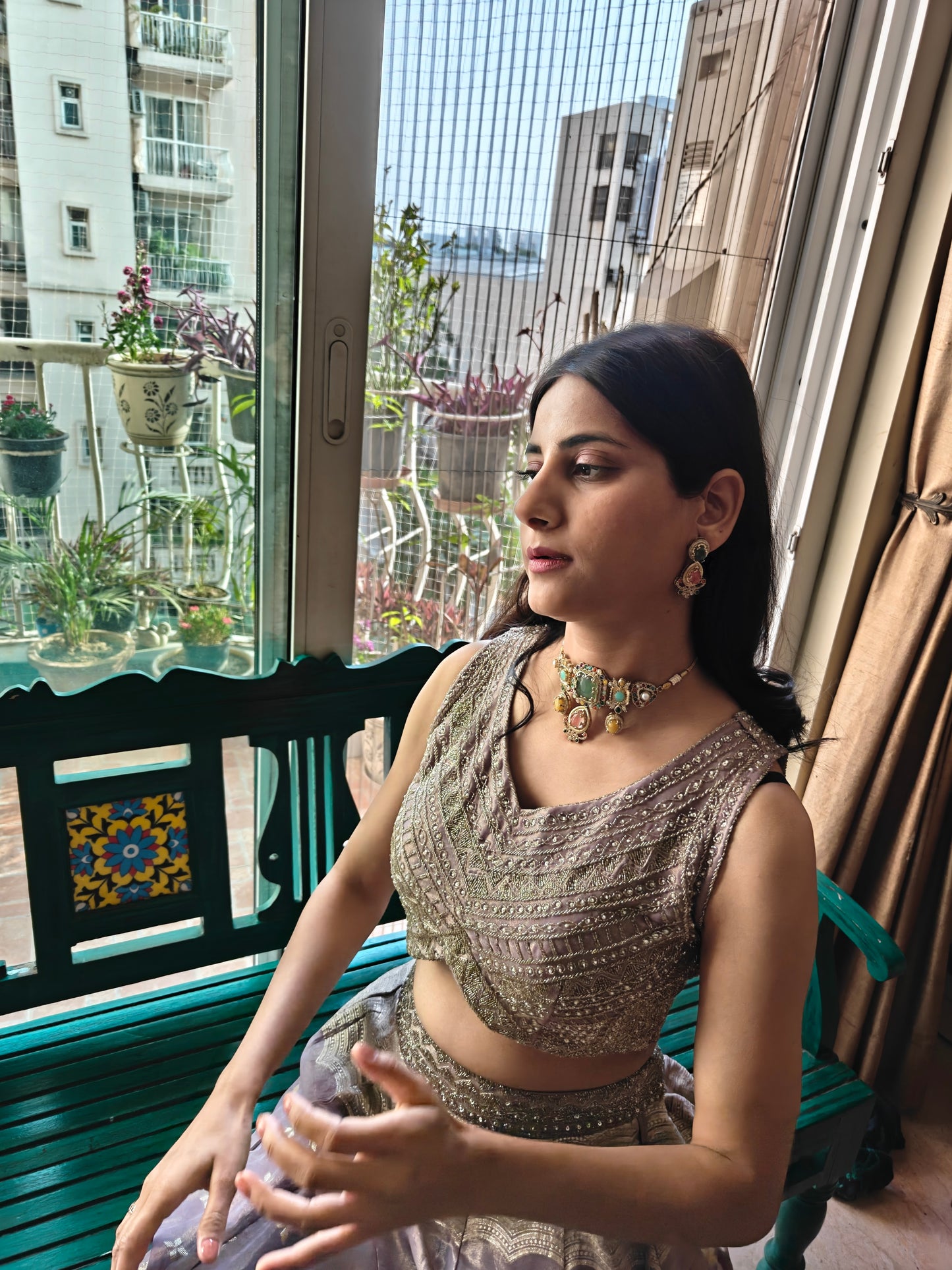 Urvi choker set with emerald green stone and Navratan stones