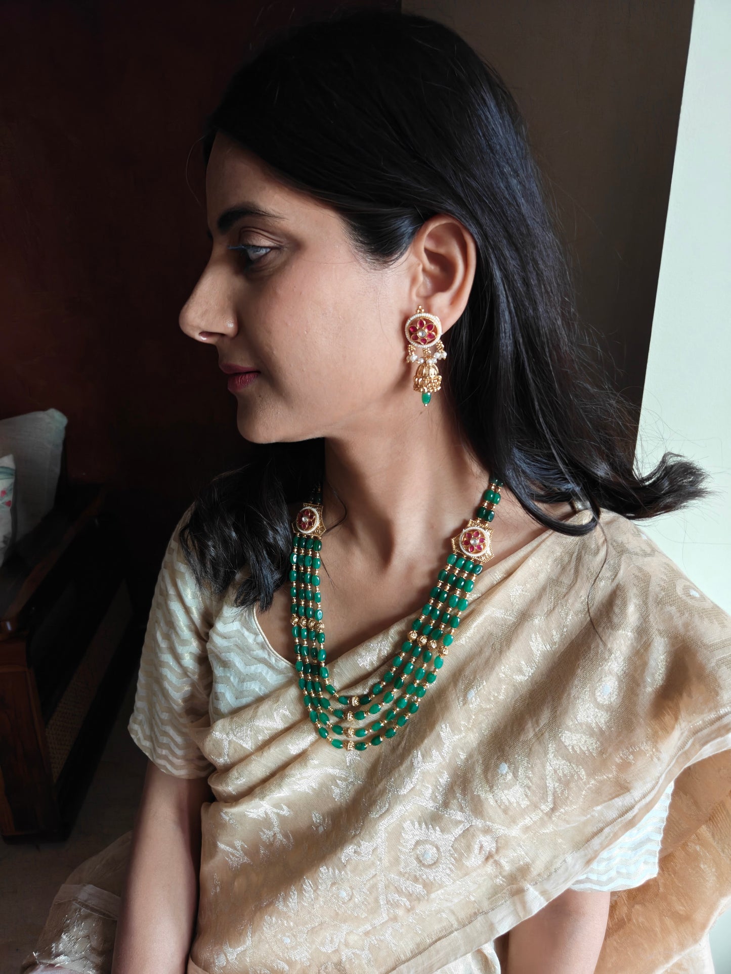 Riti emerald green stone and golden beads necklace set