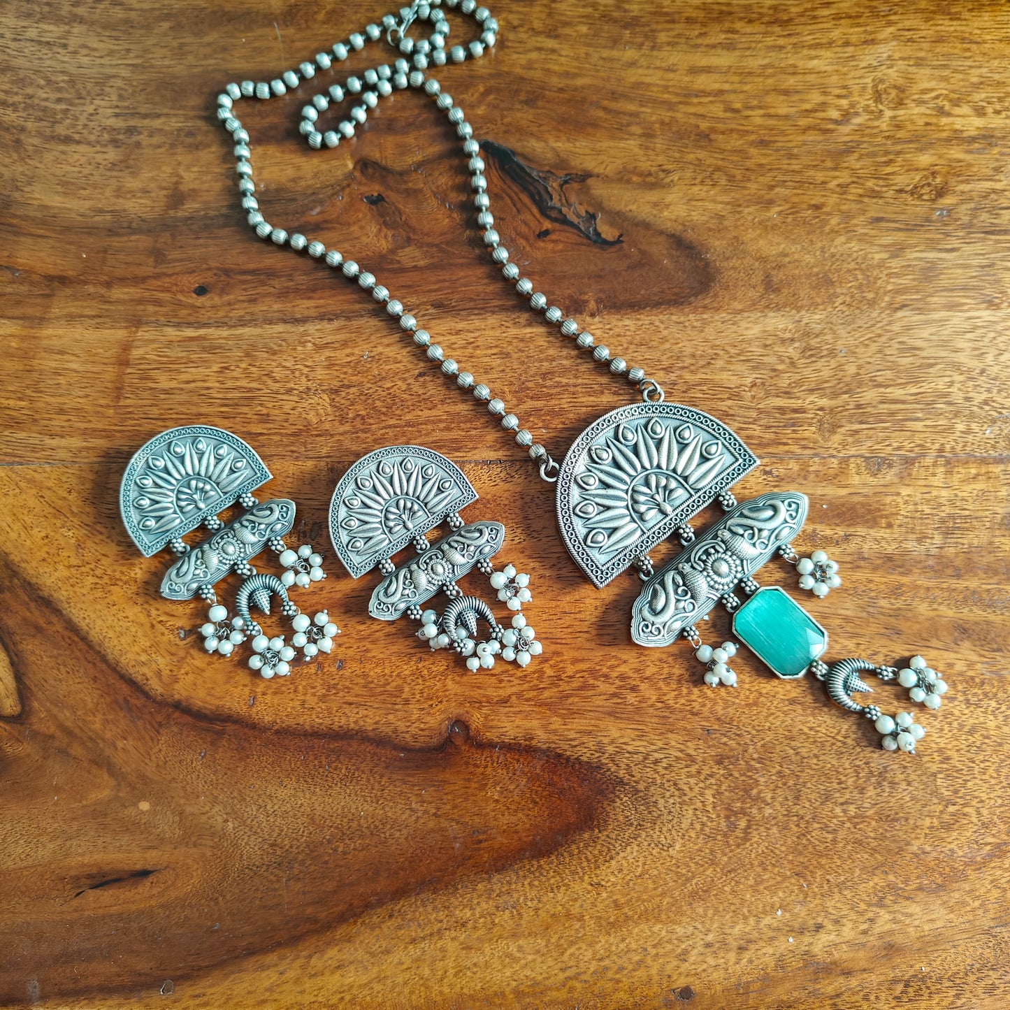 Peacock pendant set with stone and engraving