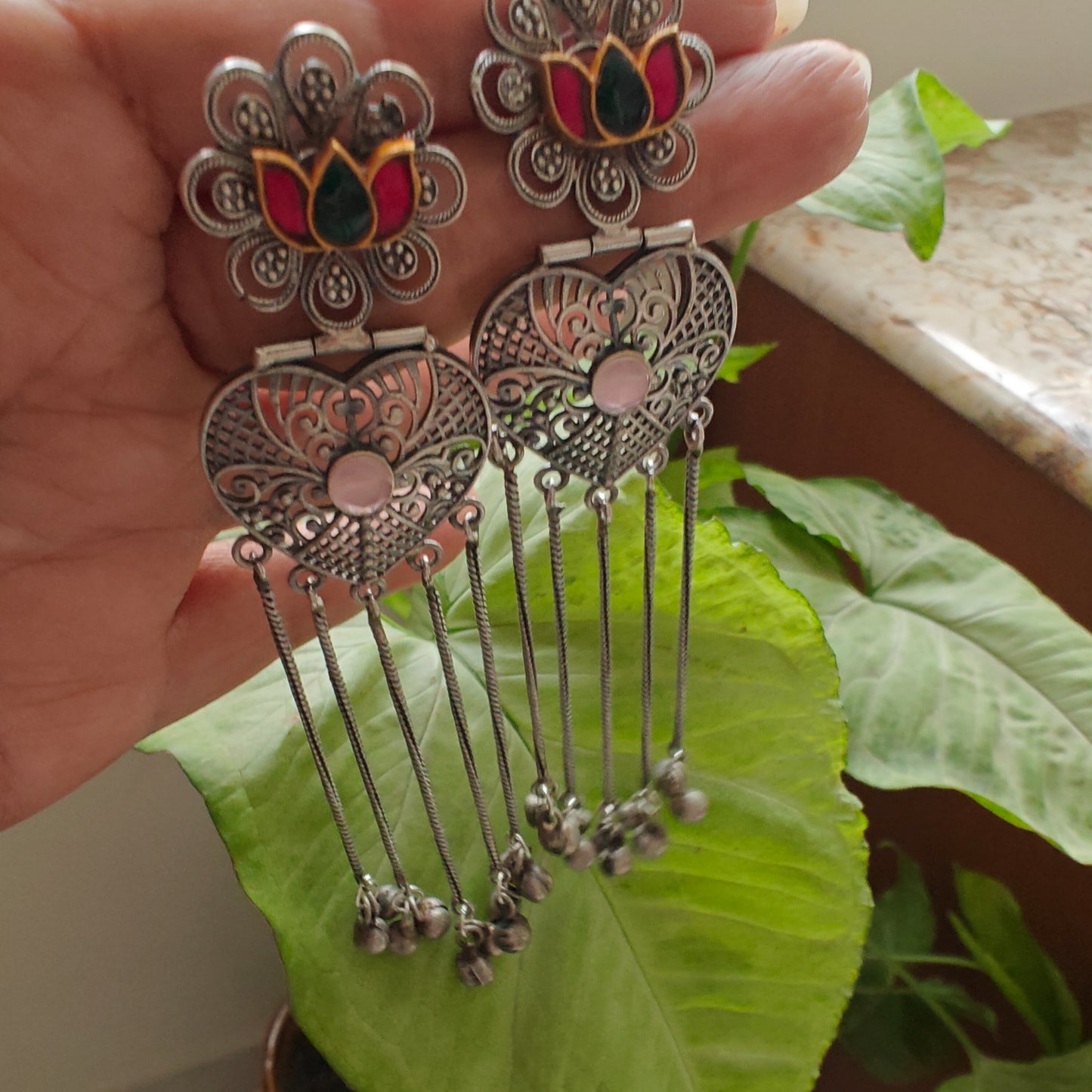 Dual tone earrings with lotus and hangings