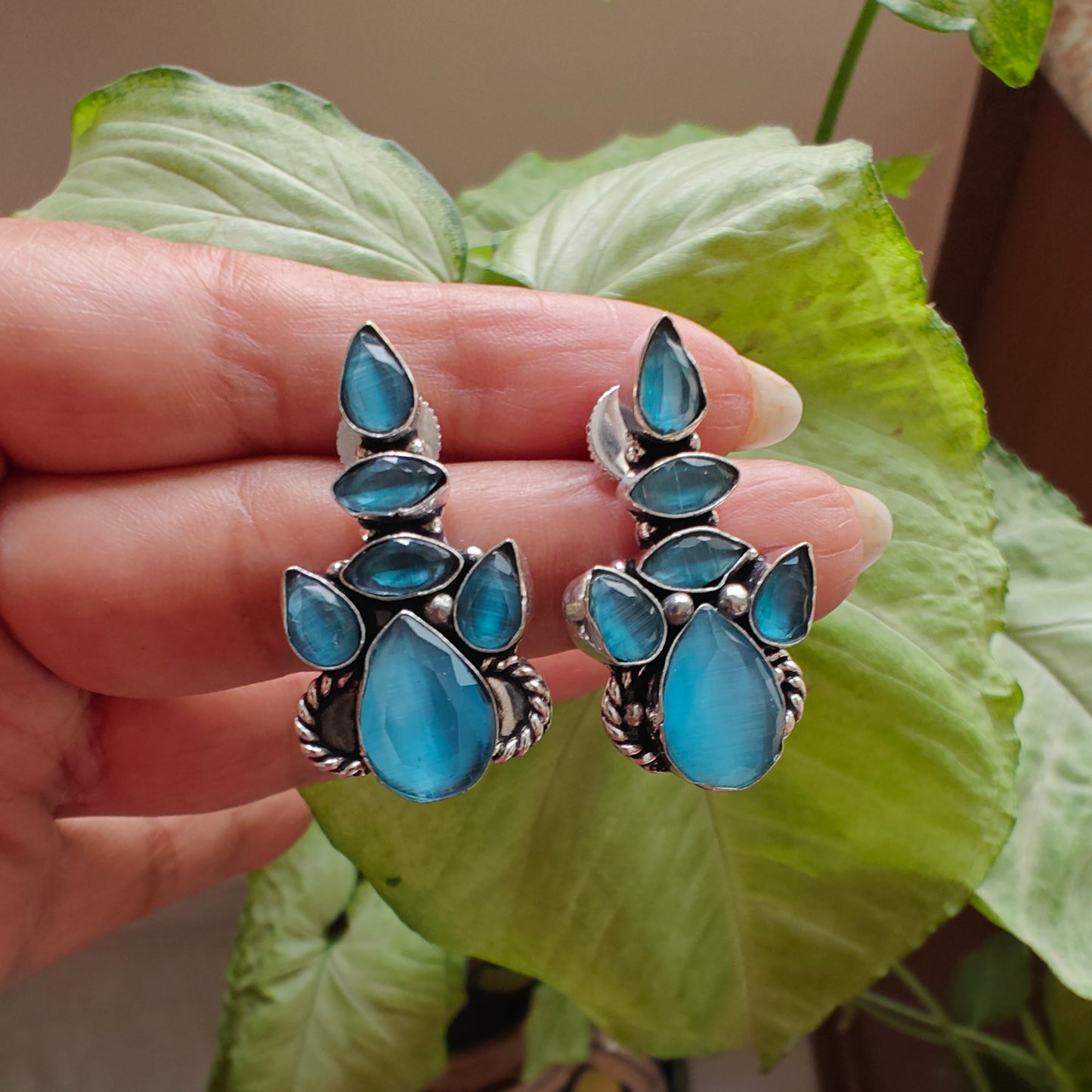 Stone earrings with enhancement