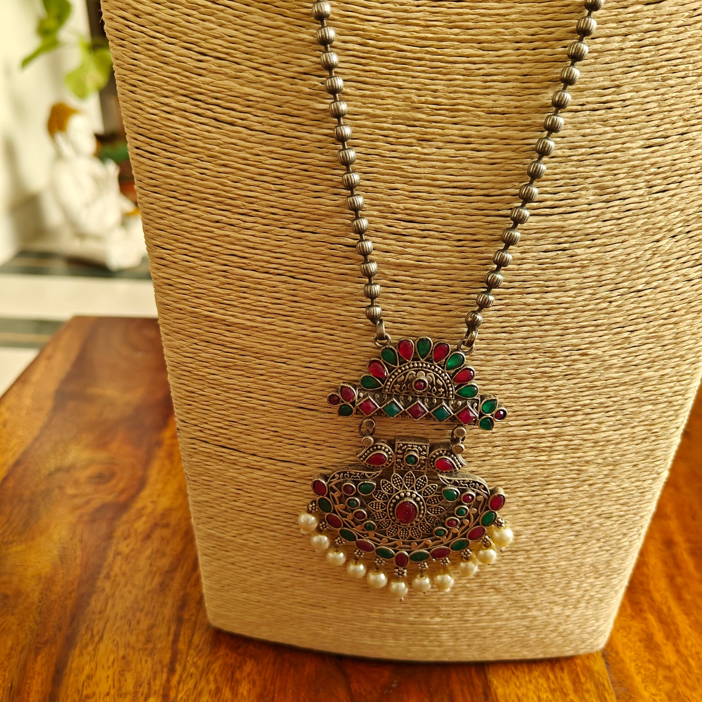 Set on bead chain with pendant with stones