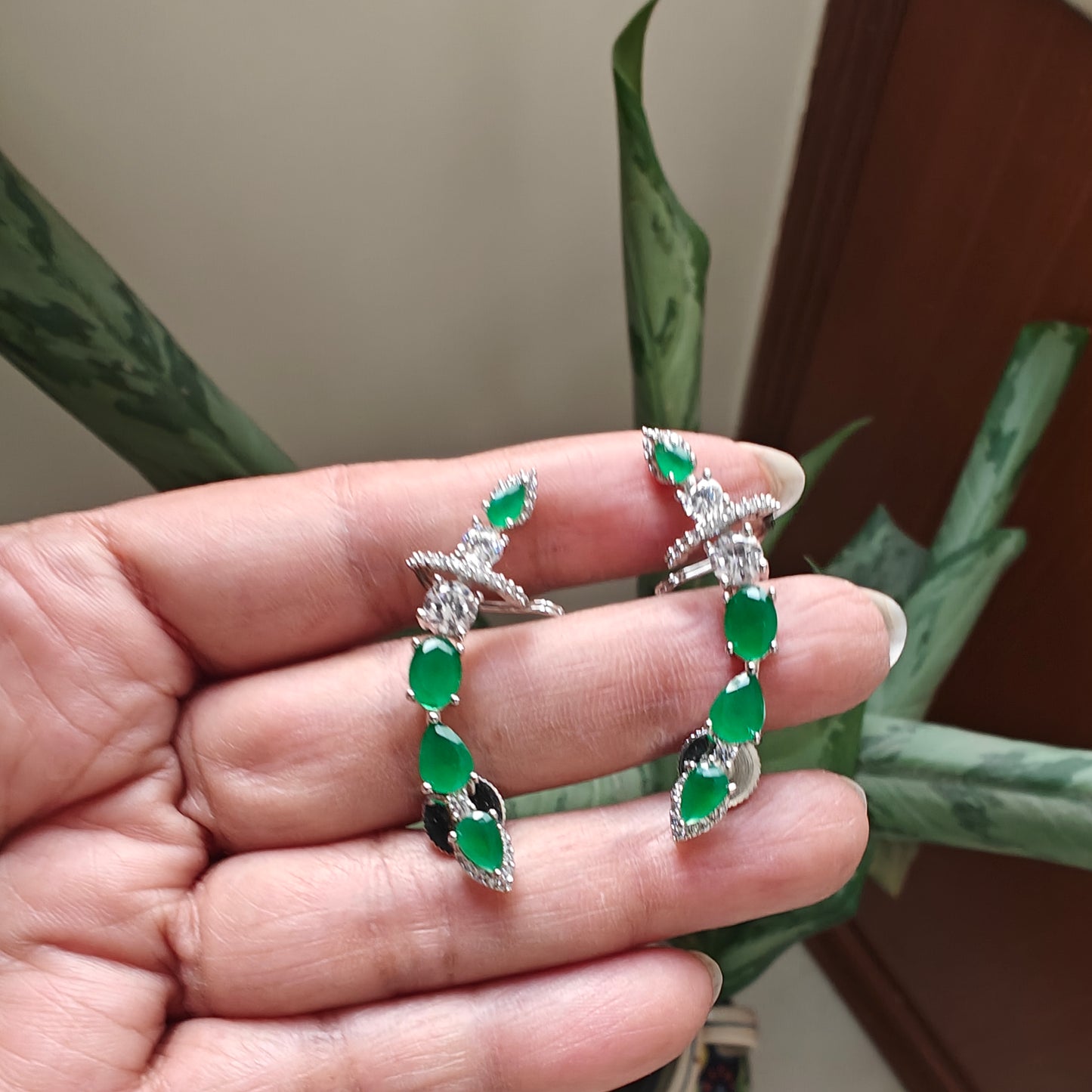Earrings with cuff in platinum finish with stone along upper ear