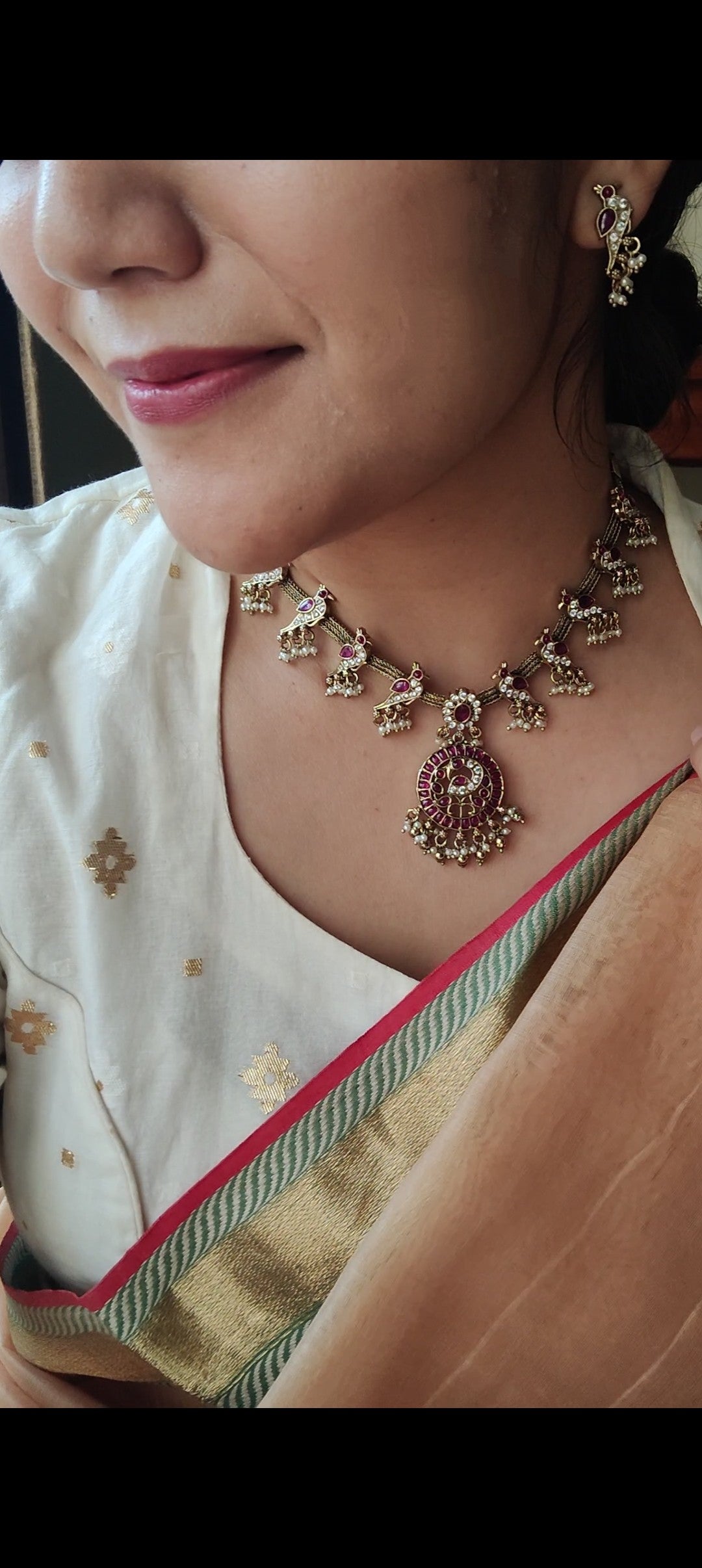 'Parindey' set with stone studded birds perched on a woven flat chain necklace