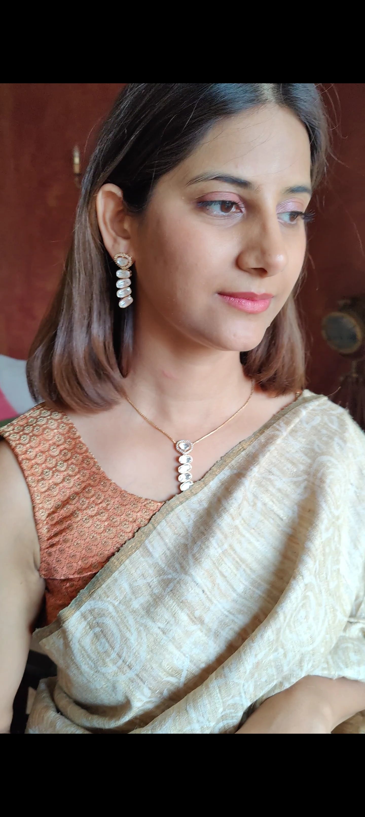 Deeptikana set with layered kundan pendant and earrings