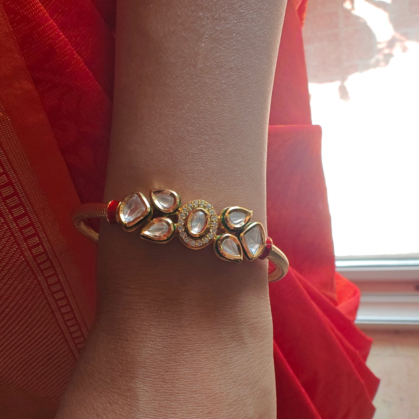 Golden kara with kundan in the centre