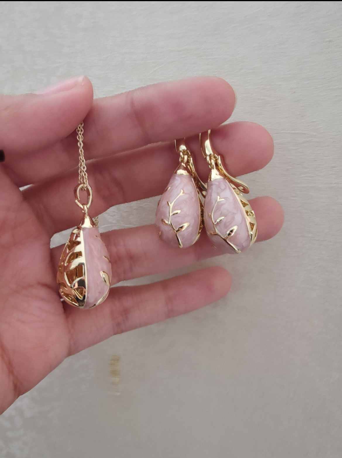 Chitrita Pendant set with pink enamel and gold work