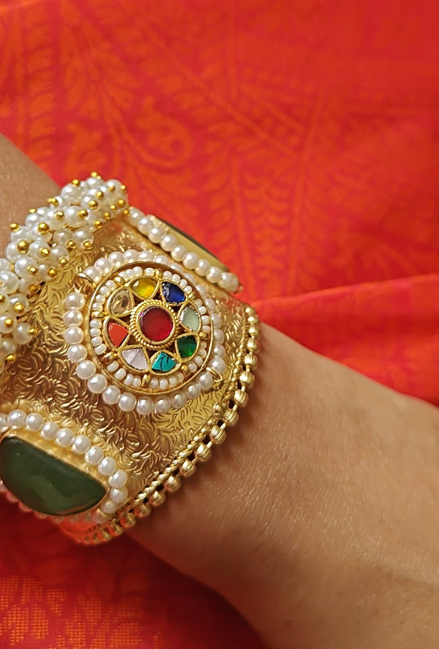 Golden Kara with navratan stones and pearls
