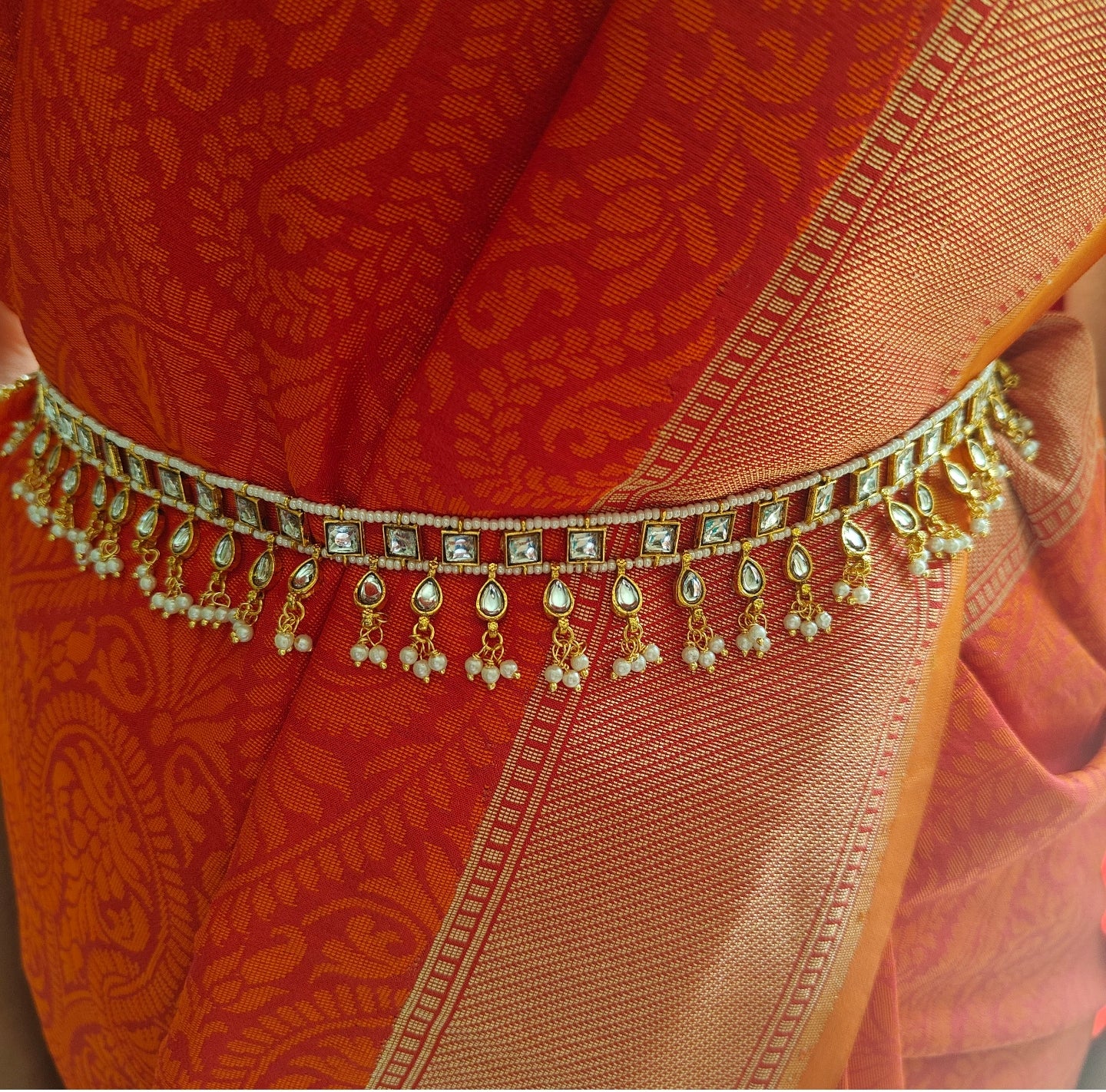 Golden belt with kundan on pearl strings, hangings below